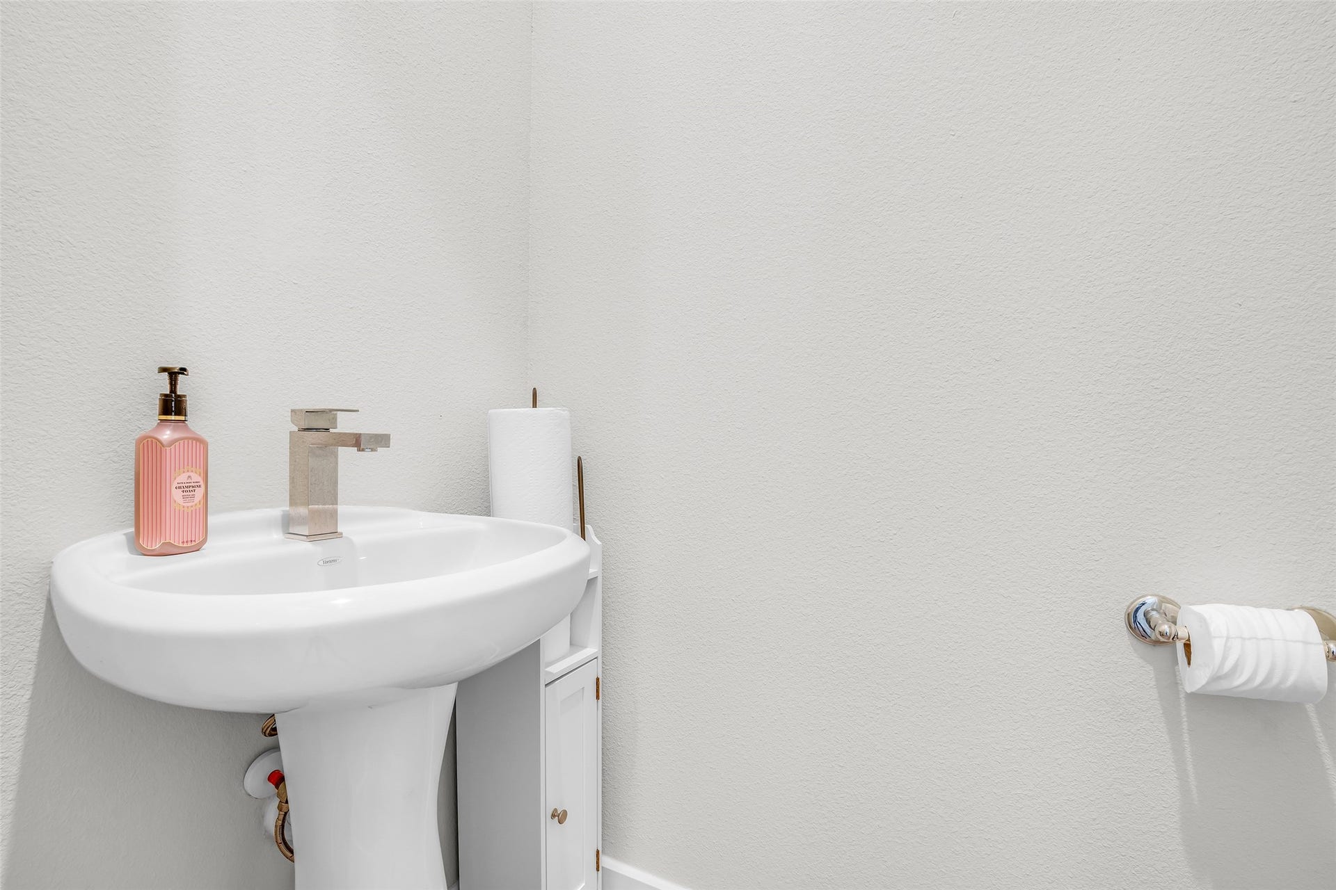 3313 Hutchins Street, Houston, TX 77004 Half bathroom featuring essential fixtures for guests, offering convenience and functionality in a compact space.