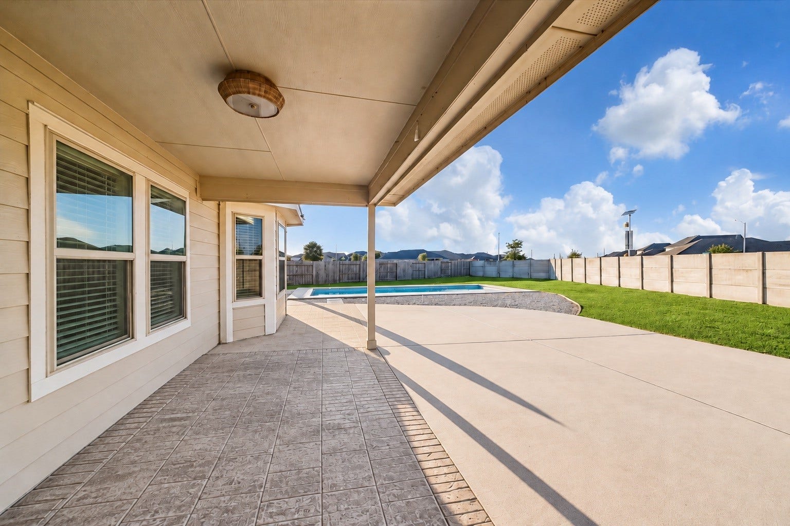 9035 Blue Star Lane, Baytown, TX 77521 Covered back patio for year-round enjoyment