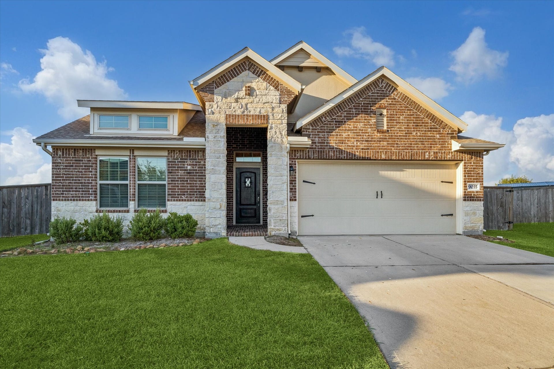 9035 Blue Star Lane, Baytown, TX 77521 Front elevation with 2-car garage