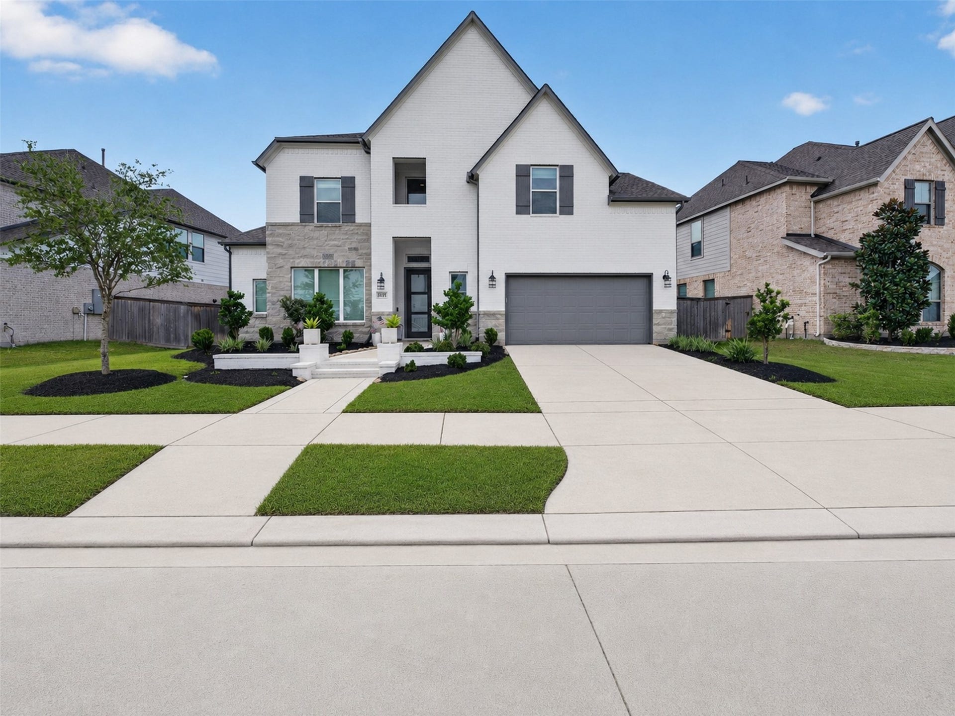 14810 Dinosaur Tracks Drive, Cypress, TX 77433 Front exterior hero view with clean curb appeal, modern elevation, landscaped walkway, and attached garage.