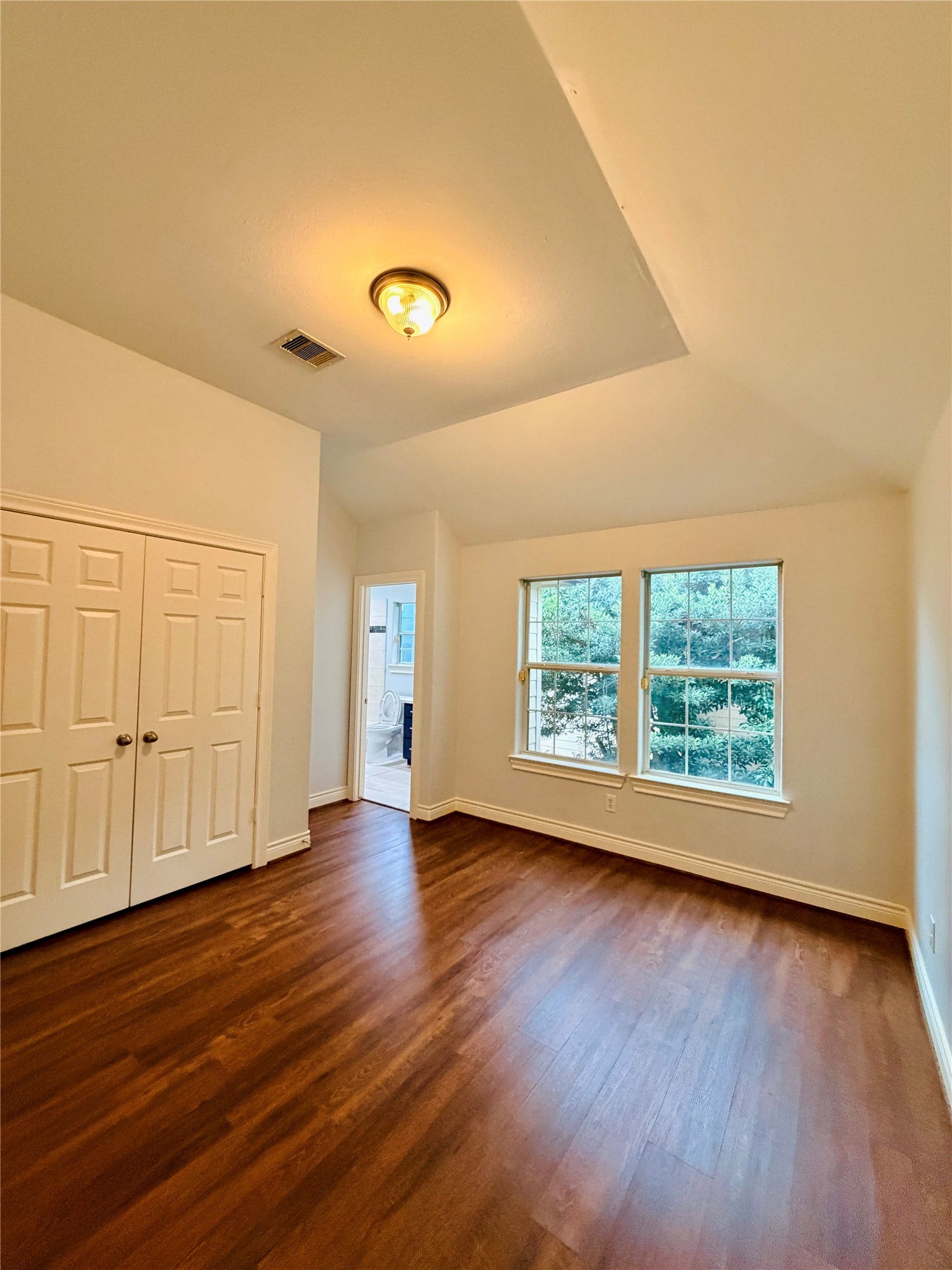 3526 Cline Street, Houston, TX 77020 Secondary bedroom with bright windows and a large spacious double-door closet.