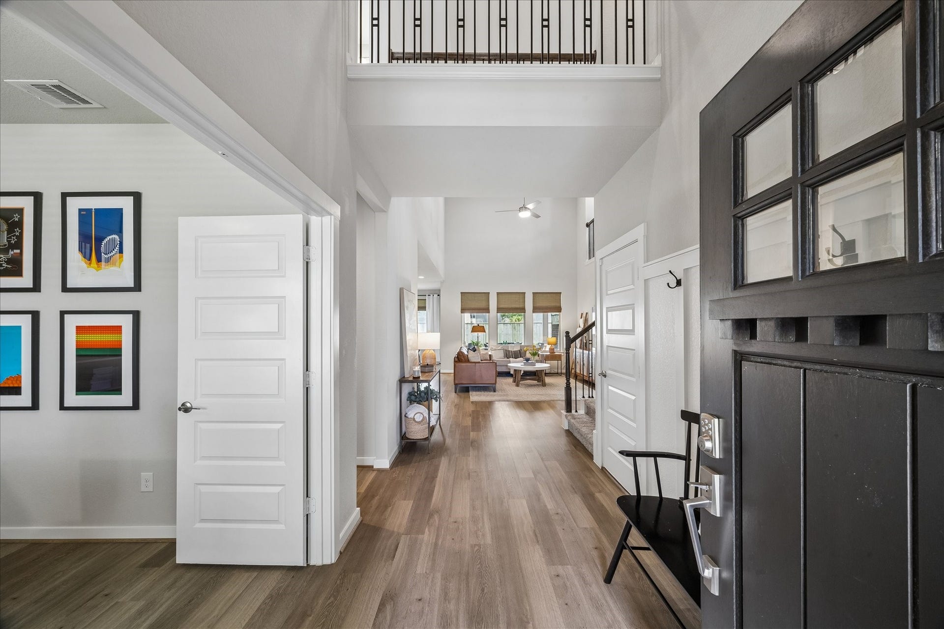 1520 Harvest Vine Court, Friendswood, TX 77546 Upon entry you are greeted with soaring ceilings, a second story cat-walk and the study. Thoughtful wainscoting with built-in hooks create a stylish and functional drop zone, adding both charm and everyday convenience to the foyer.