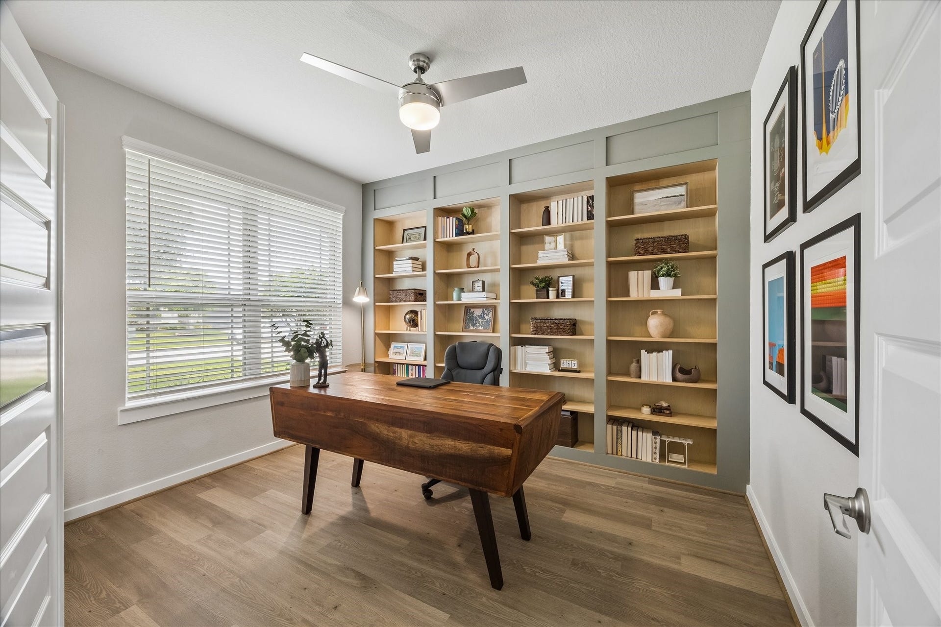 1520 Harvest Vine Court, Friendswood, TX 77546 Elegant first floor study filled with natural light, feturing beautiful built-ins and a refined workspace.