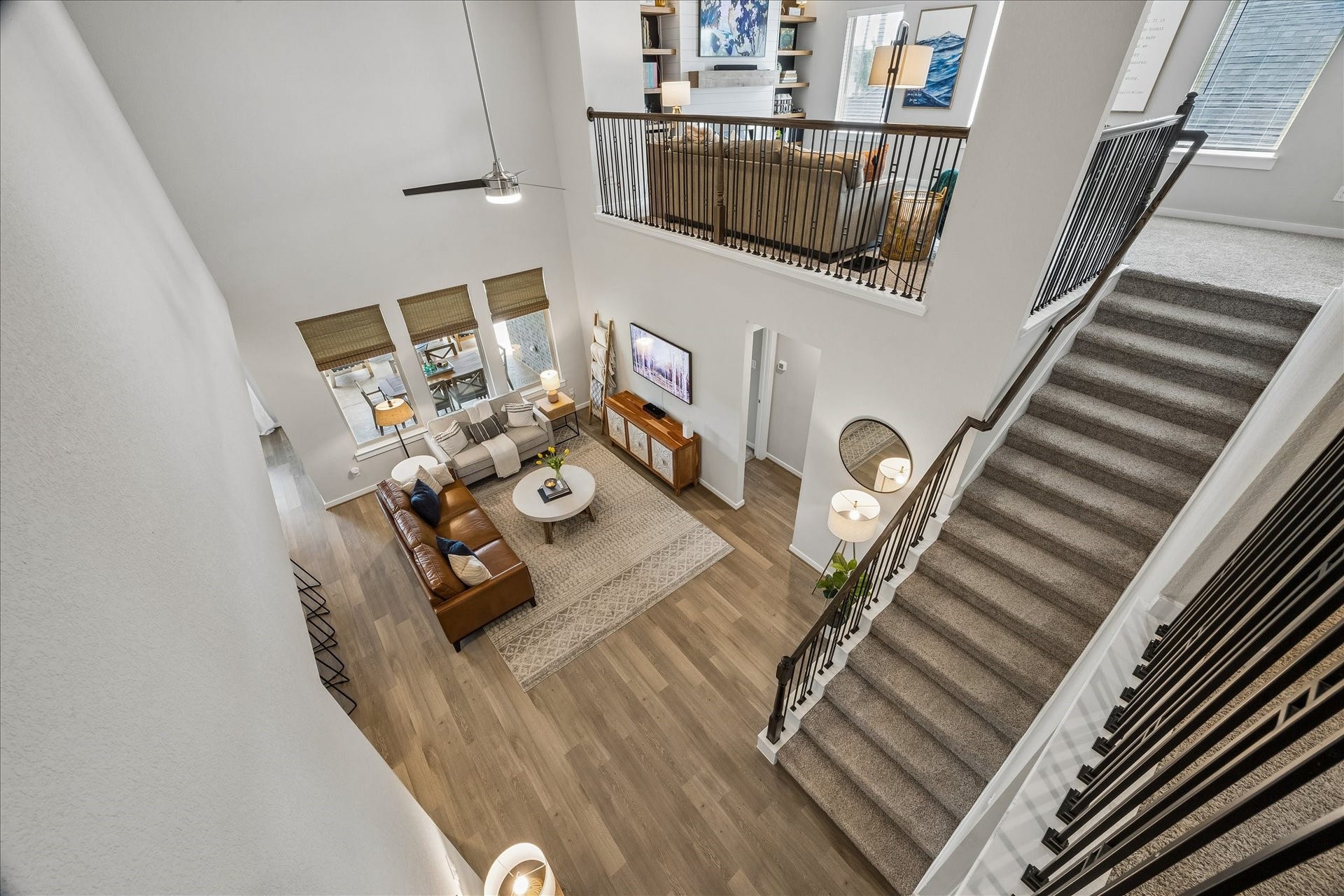1520 Harvest Vine Court, Friendswood, TX 77546 View of the living room and kitchen.