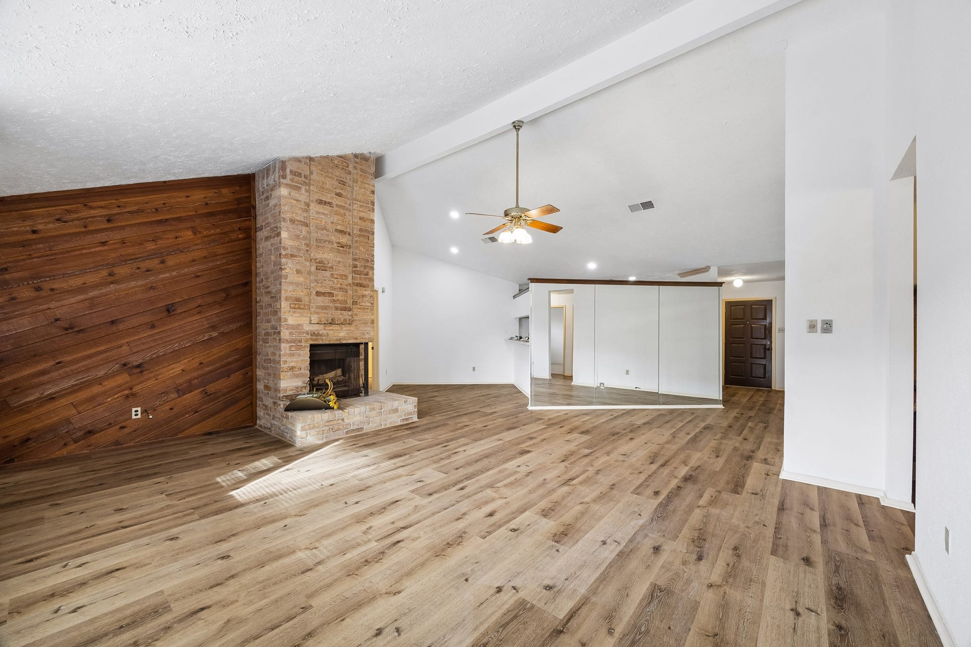 2319 Hampton Road, League City, TX 77573 Tall ceilings, wood-look LVP flooring and updated lighting!