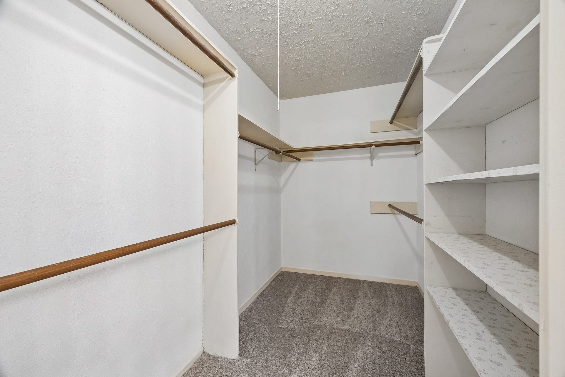 2319 Hampton Road, League City, TX 77573 HUGE walk-in closet in the primary bedroom provides varied level hanging rods and shelves too!