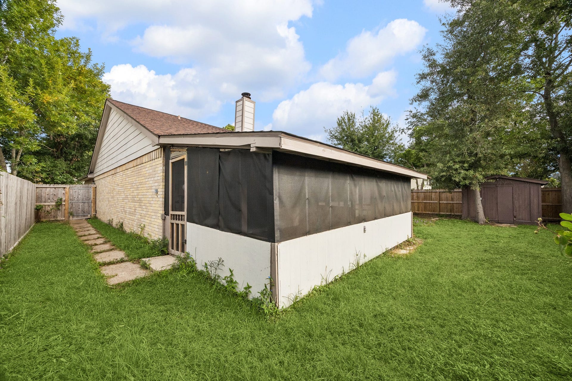 2319 Hampton Road, League City, TX 77573 Side yard has paver path for guest access to screened-in porch