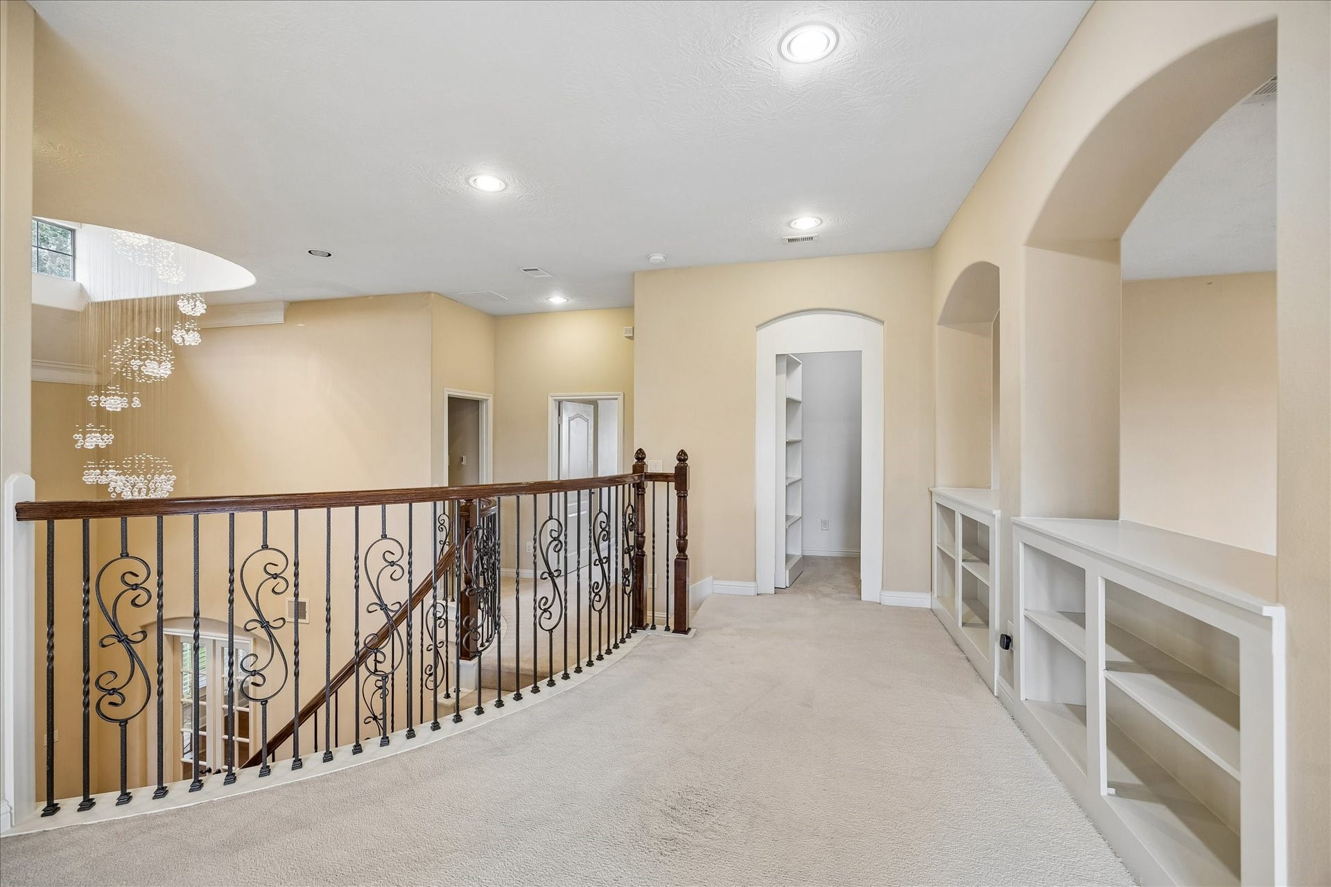 4506 Beacon View Court, Sugar Land, TX 77479 At the top of the staircase, you'll be surprised to find a hidden storage area with a bookcase door!