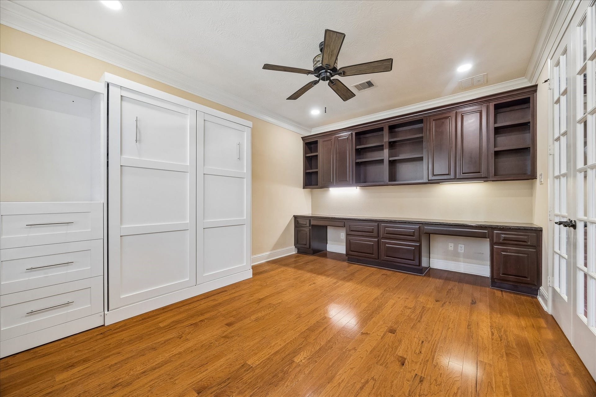 4506 Beacon View Court, Sugar Land, TX 77479 Super functional home office with built-ins, double French Doors and Murphy bed.