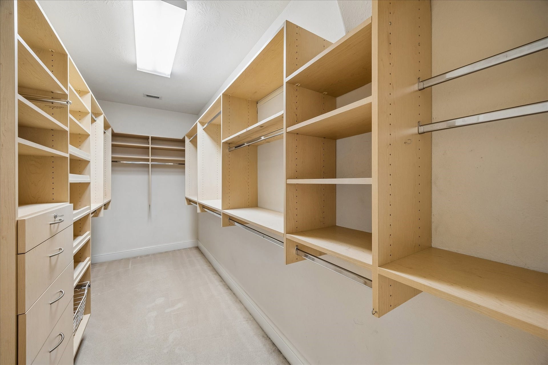 4506 Beacon View Court, Sugar Land, TX 77479 This is one of the two walk-in primary closets. The second closet also features custom built-ins.