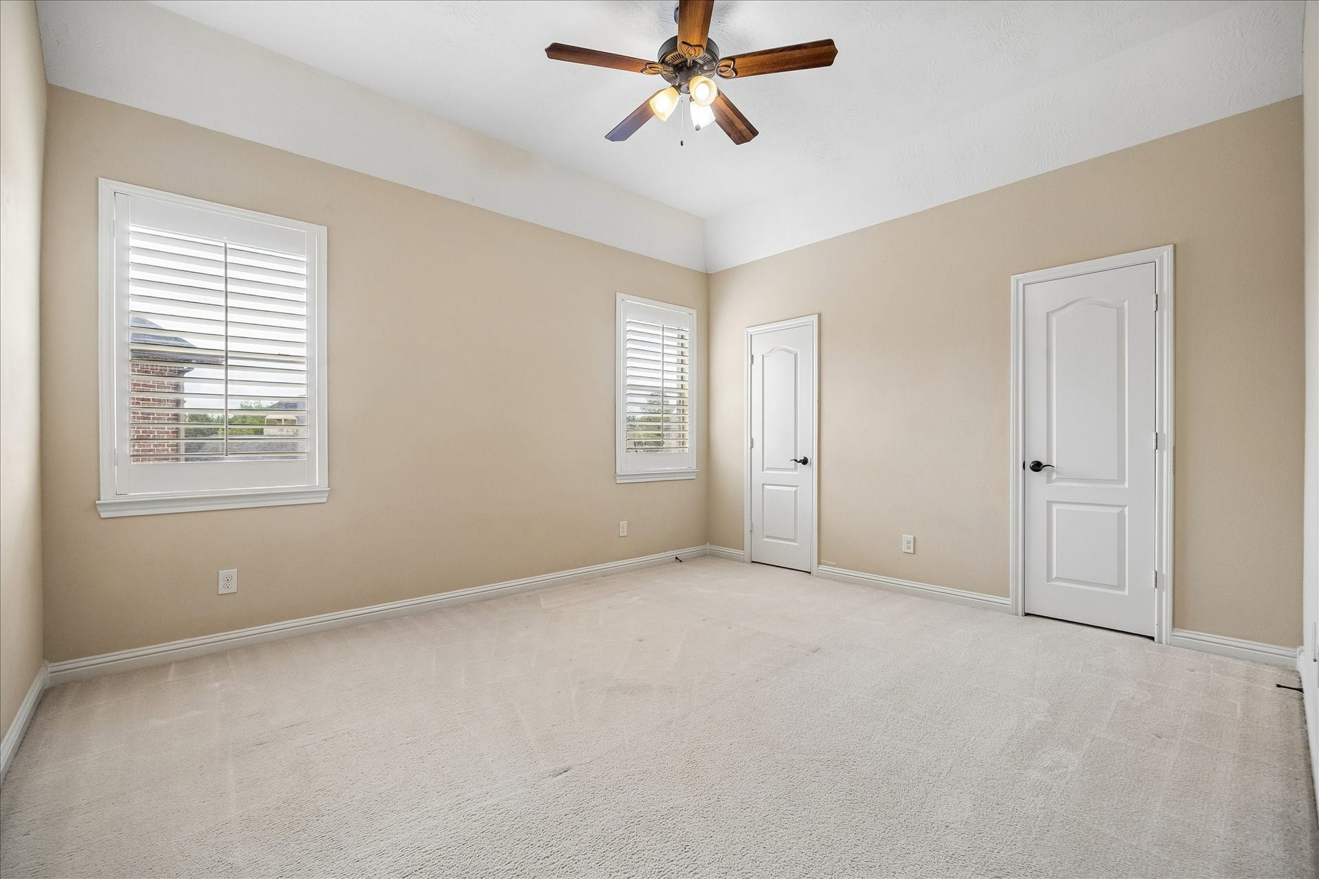 4506 Beacon View Court, Sugar Land, TX 77479 Second floor Bedroom #3 with custom shutters and two closets.