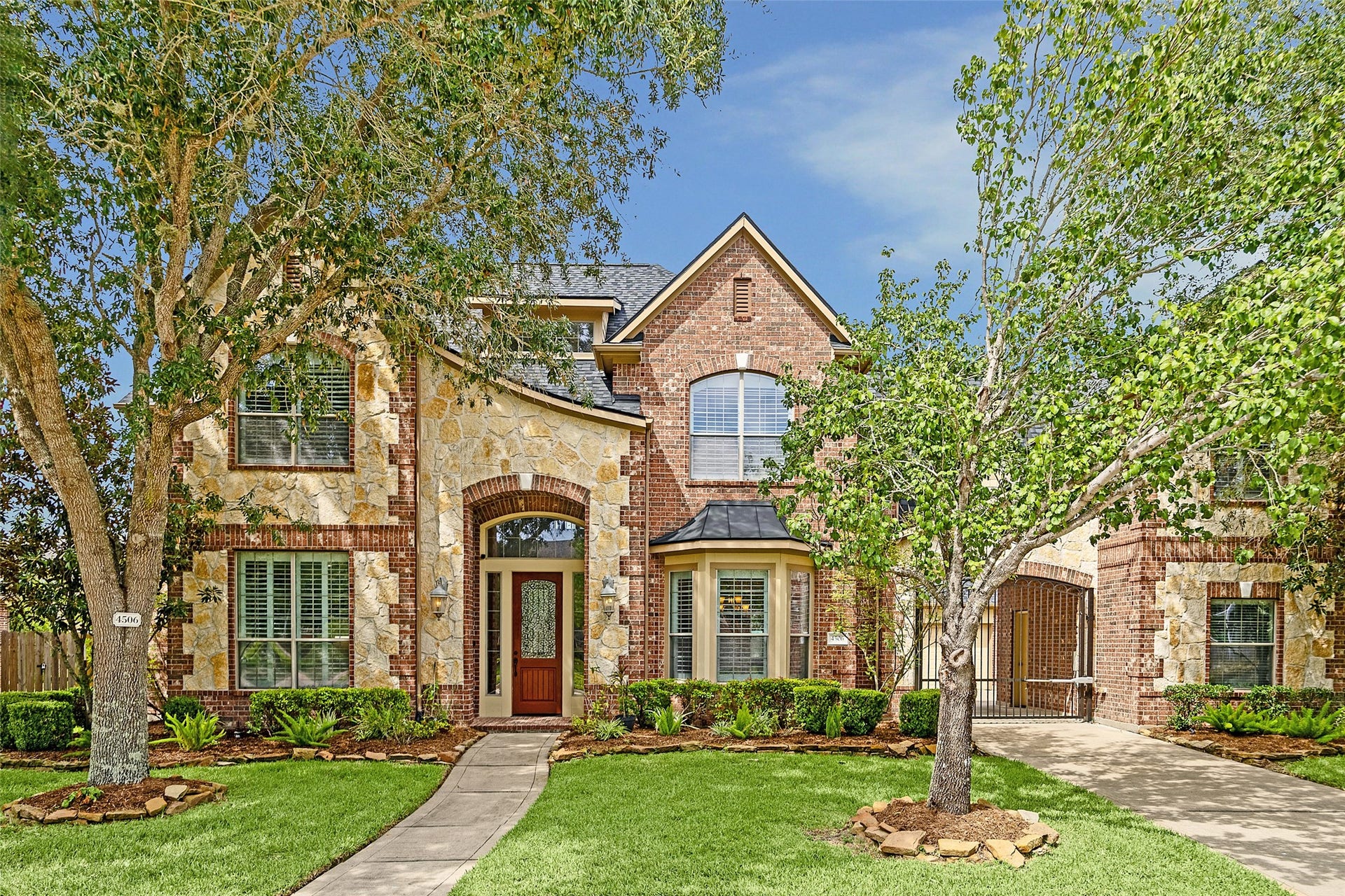 4506 Beacon View Court, Sugar Land, TX 77479 Elegant brick and stone exterior with beautiful architectural details.
