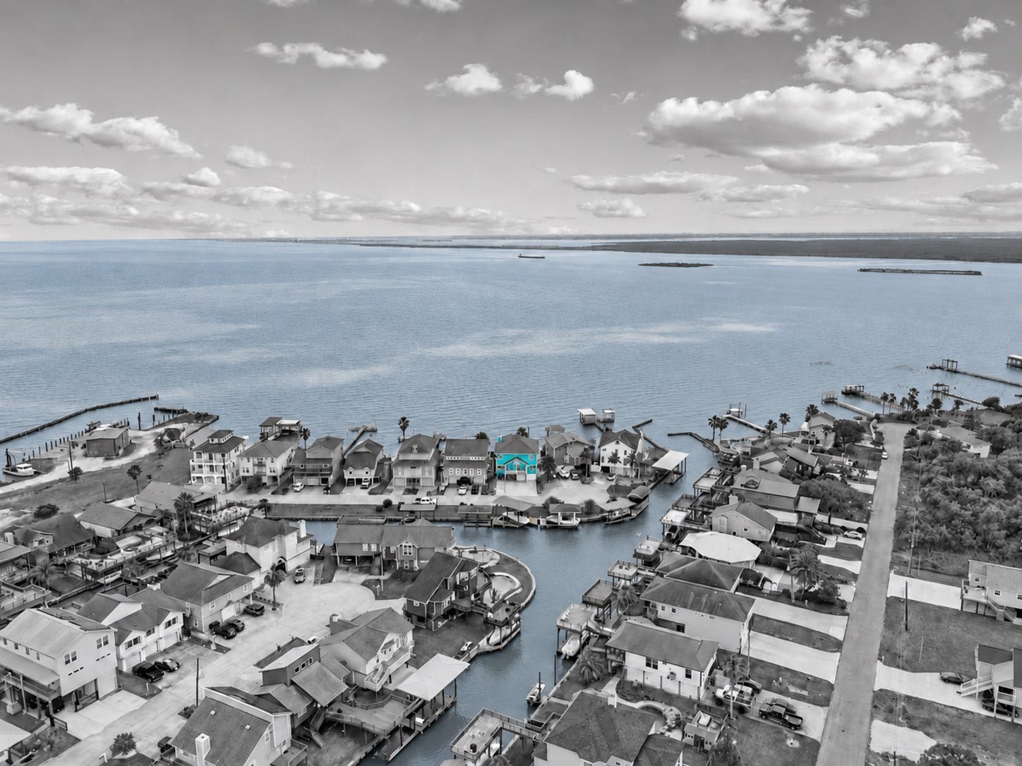 1331 EDWARDS DRIVE, Dickinson, TX 77539 WATERFRONT LOCATION WITH DIRECT CANAL ACCESS AND EXPANSIVE VIEWS OF GALVESTON BAY. THE HIGHLIGHTED HOME SITS JUST STEPS FROM OPEN WATER.