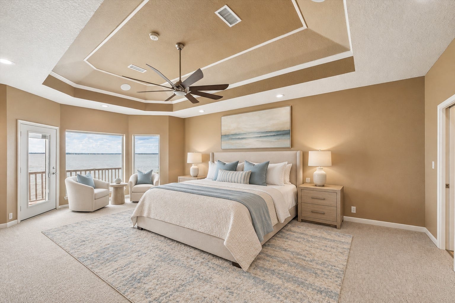 1331 EDWARDS DRIVE, Dickinson, TX 77539 THE SPACIOUS PRIMARY SUITE FEATURES A MULTILEVEL TRAY CEILING, RECESSED LIGHTING, LARGE WATER-FACING WINDOWS, AND PRIVATE BALCONY ACCESS. **Virtually Staged.