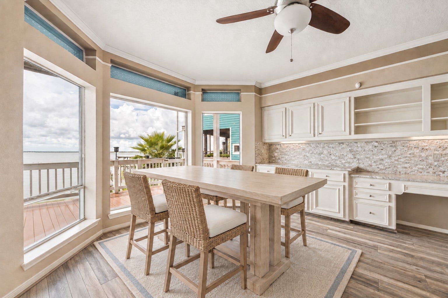 1331 EDWARDS DRIVE, Dickinson, TX 77539 THE KITCHEN OFFERS ABUNDANT CABINETRY, EXTENSIVE COUNTER SPACE, AND LARGE WINDOWS WITH DIRECT WATER VIEWS. **Virtually Staged.
