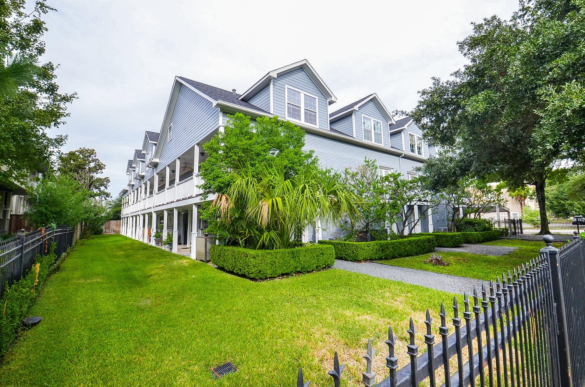 Charming community, fully fenced with grassy areas for residents.