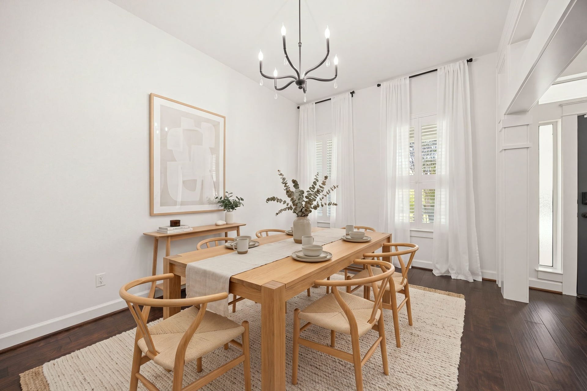 23 Pipers Meadow Street, The Woodlands, TX 77382 Host unforgettable gatherings in the elegant formal dining space, beautifully appointed with a modern chandelier, warm hardwood flooring, and bright windows outfitted with plantation shutters. *Virtually Staged
