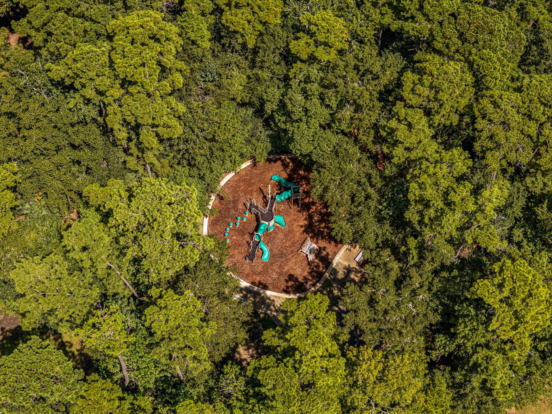 23 Pipers Meadow Street, The Woodlands, TX 77382 Steps from your front door. An aerial look at the neighborhood's cozy Cottage Green Park, featuring a wonderful playground nestled under a thick canopy of mature trees.
