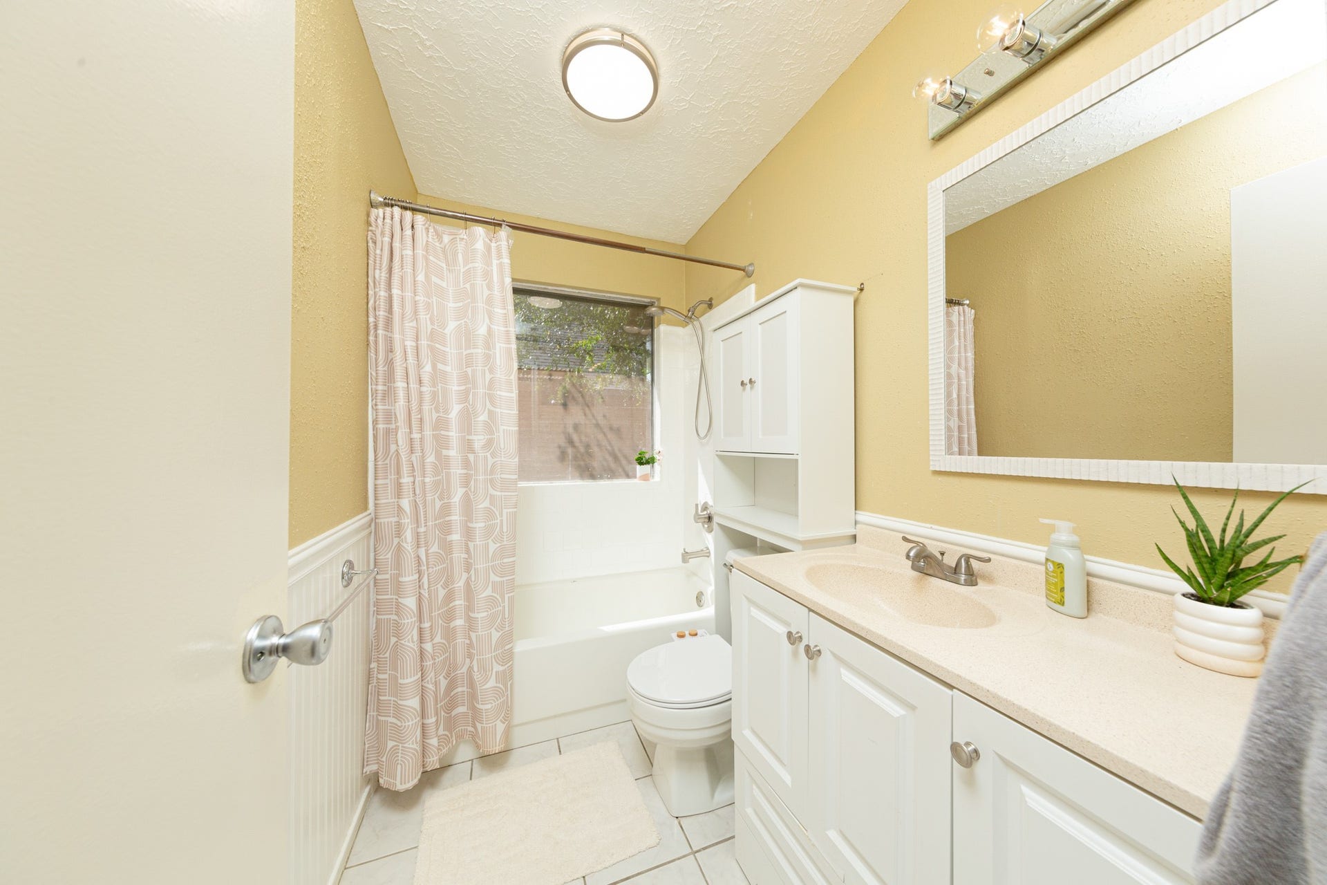 2107 Foundary Drive, Katy, TX 77493 The secondary bathroom features a tub-and-shower combination, spacious vanity, tile flooring, and convenient storage.