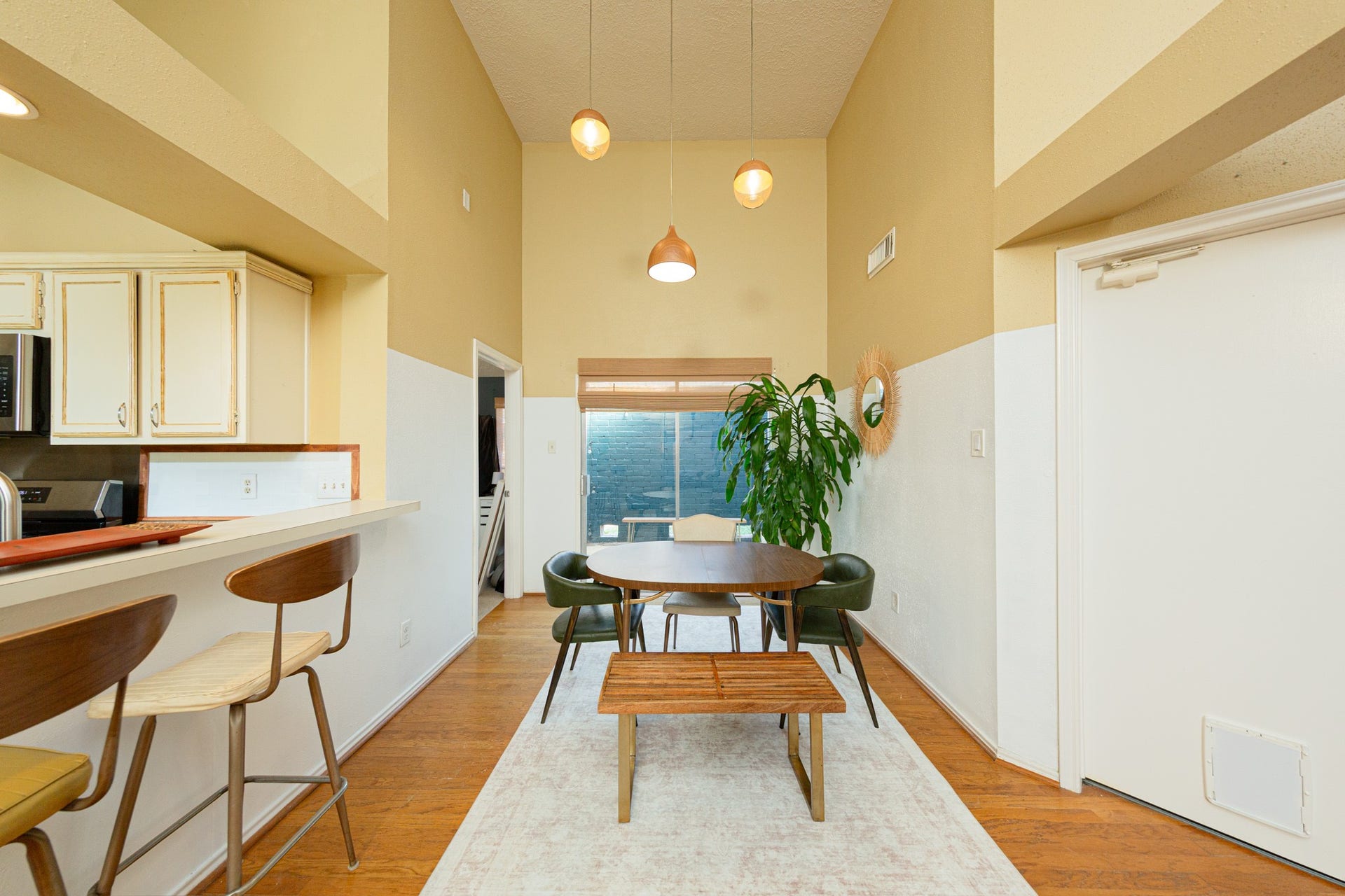 2107 Foundary Drive, Katy, TX 77493 Enjoy casual dining beneath stylish pendant lighting, with convenient access to the kitchen and views of the backyard through sliding glass doors.