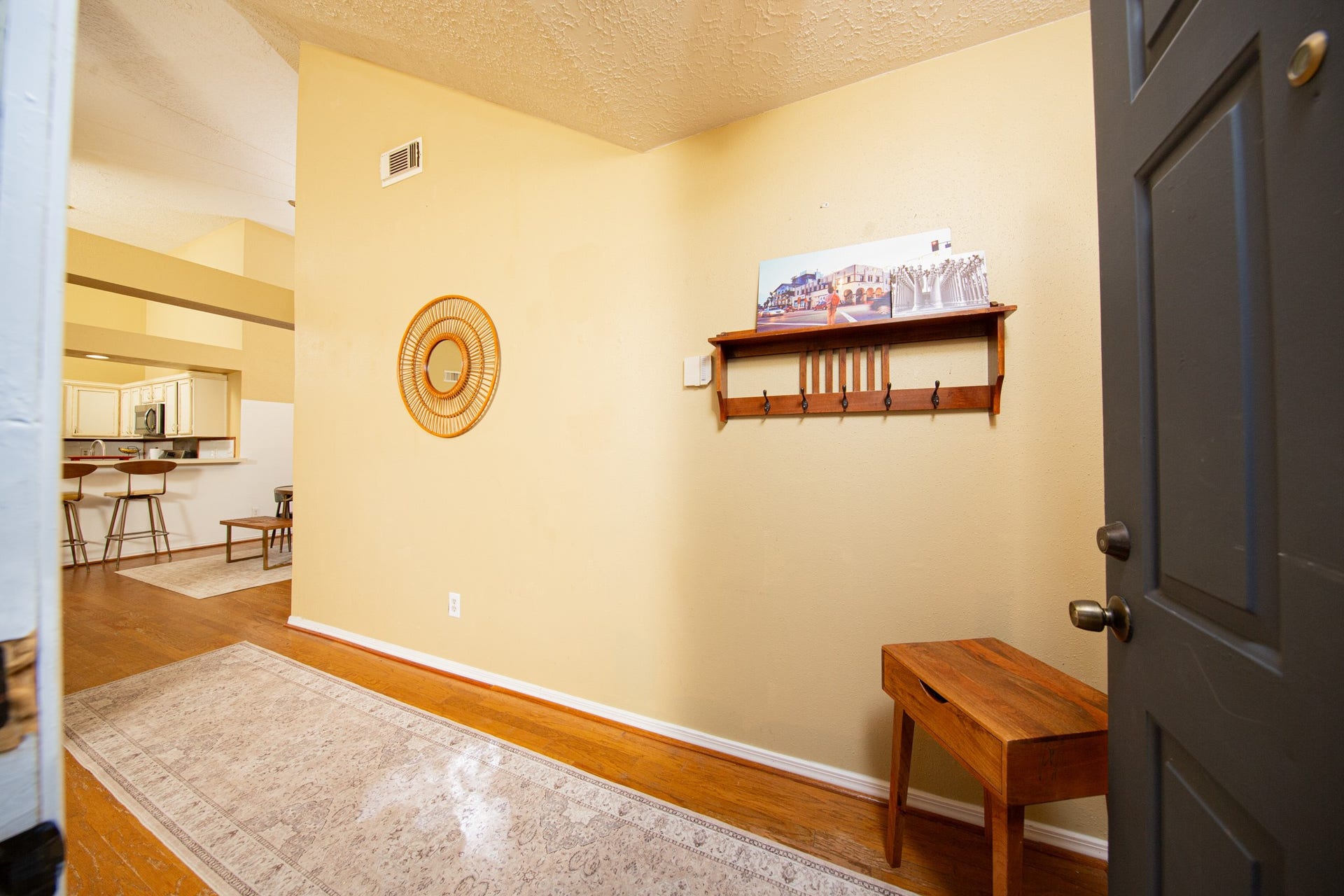2107 Foundary Drive, Katy, TX 77493 Step inside to a welcoming entryway featuring warm laminate wood flooring, natural light, and a convenient space for an entry table or decorative accents.