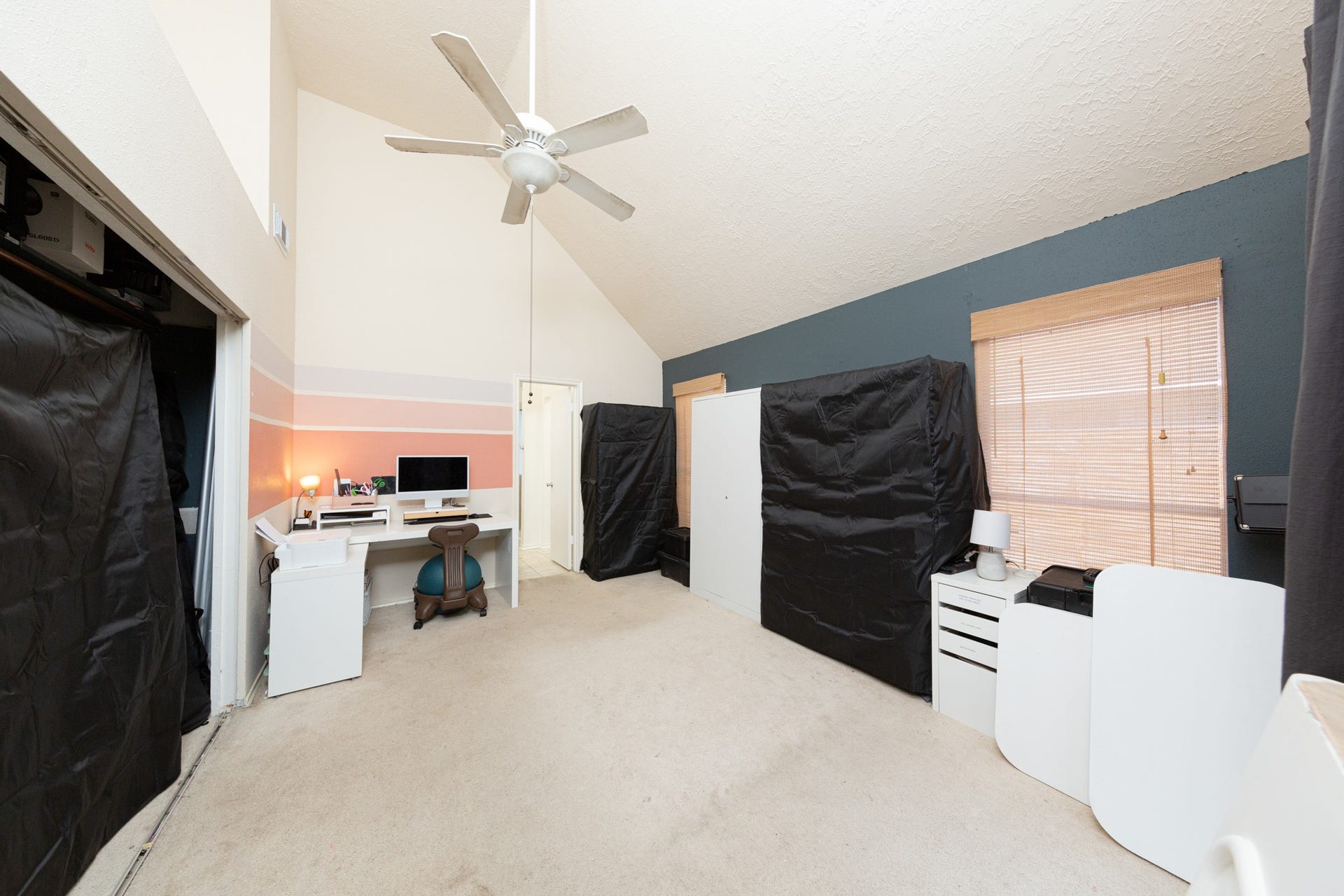 2107 Foundary Drive, Katy, TX 77493 The primary bedroom features vaulted ceilings, a ceiling fan, neutral finishes, and a versatile layout to suit your needs.