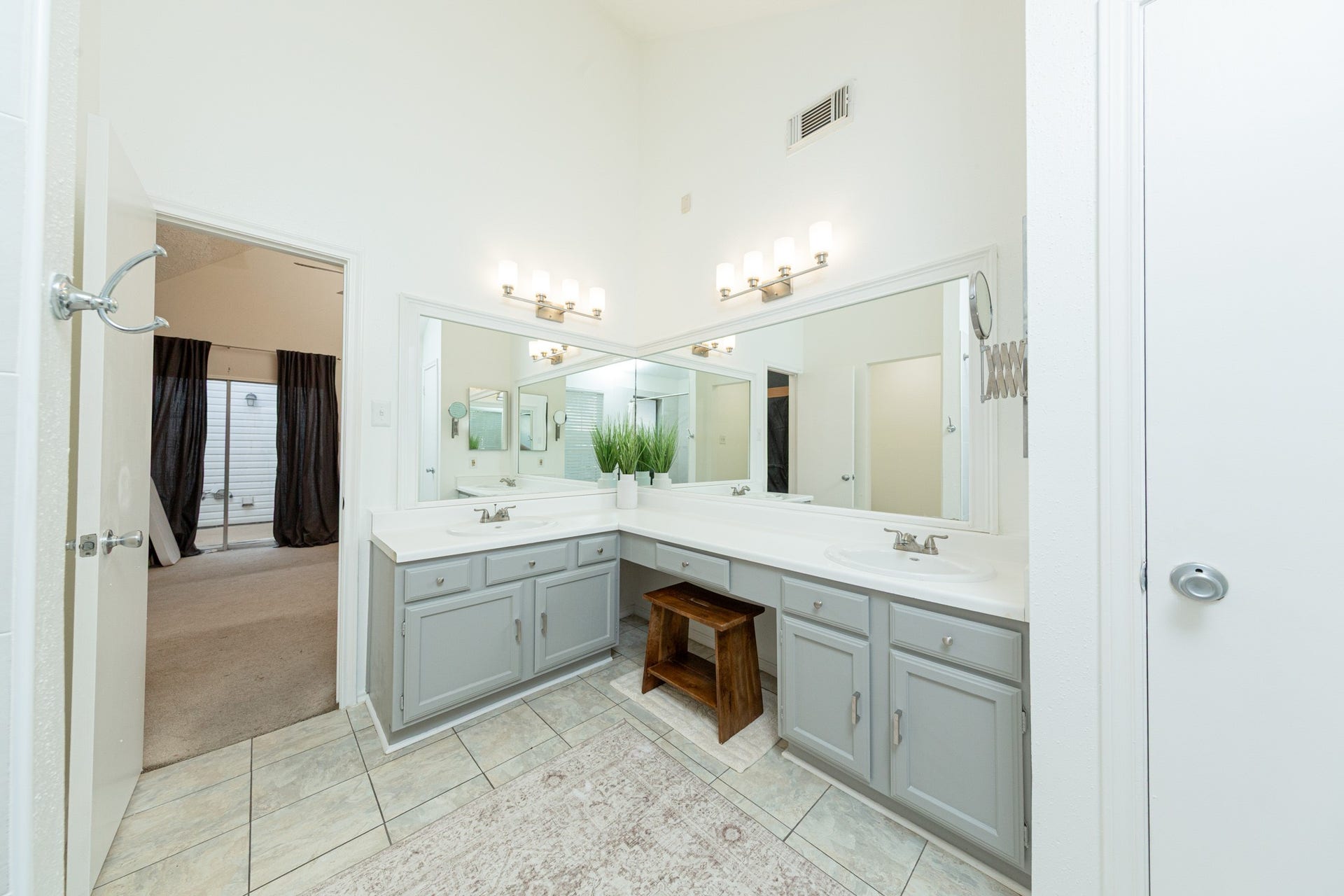 2107 Foundary Drive, Katy, TX 77493 This generously sized primary bedroom features vaulted ceilings and a flexible layout, currently arranged as a creative workspace.
MLS-45 The primary bathroom offers an expansive vanity, tile flooring, natural light, and a beautifully updated walk-in shower.