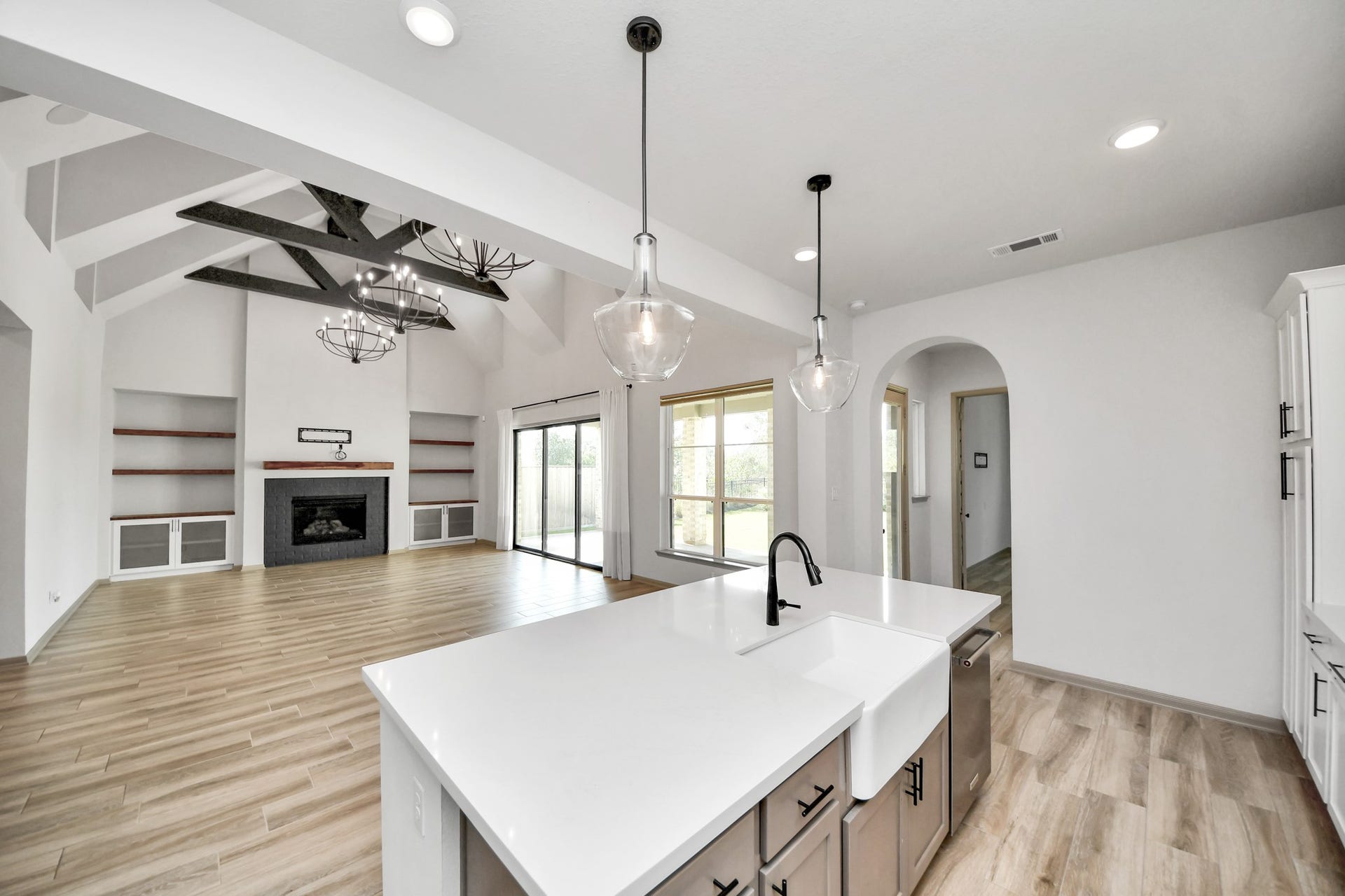 1423 Hackberry Heights Drive, Richmond, TX 77406 Stunning open-concept living space featuring a modern kitchen with a large island.
