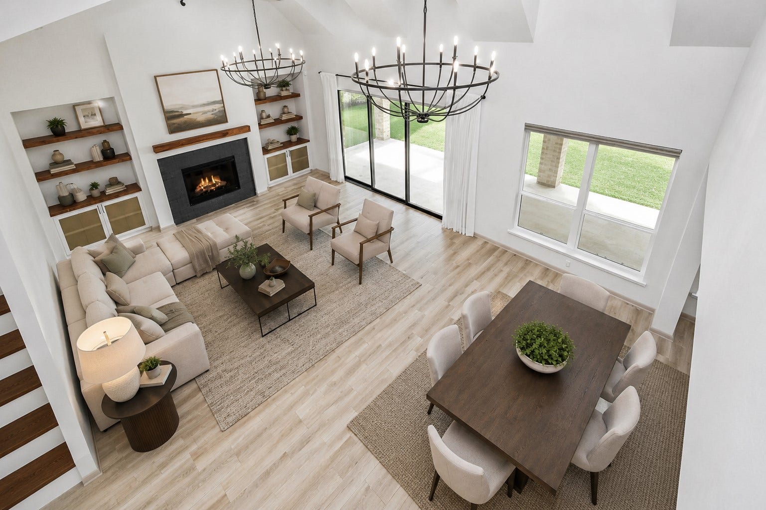 1423 Hackberry Heights Drive, Richmond, TX 77406 Experience modern elegance in this virtually staged, open-concept living and dining area, featuring a cozy fireplace, stylish shelving, and abundant natural light from expansive windows and sliding doors leading to the patio.