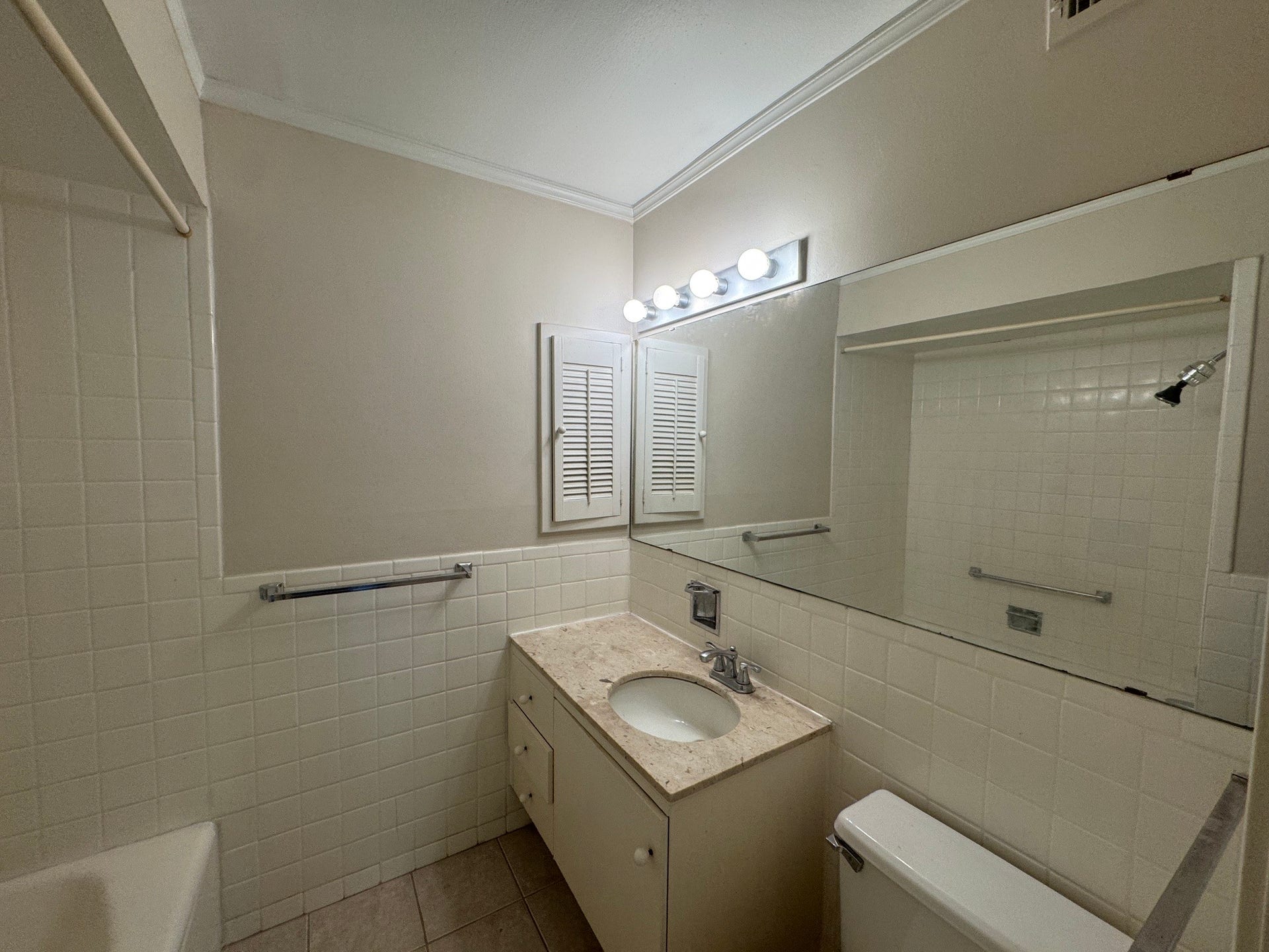 2600 Bellefontaine Street, #A18, Houston, TX 77025 Primary Bath with large wall mirror and marble counter