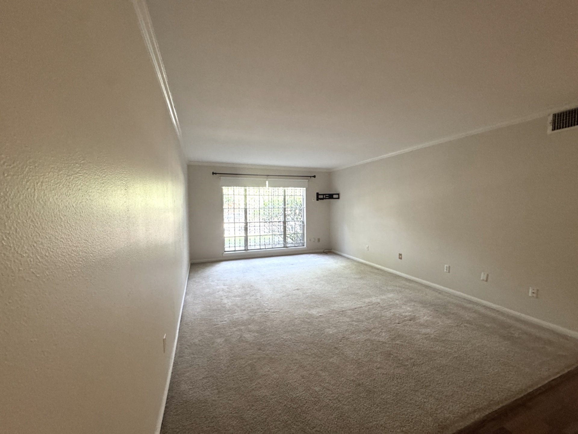 2600 Bellefontaine Street, #A18, Houston, TX 77025 Living area from entry hall with recent neutral carpet