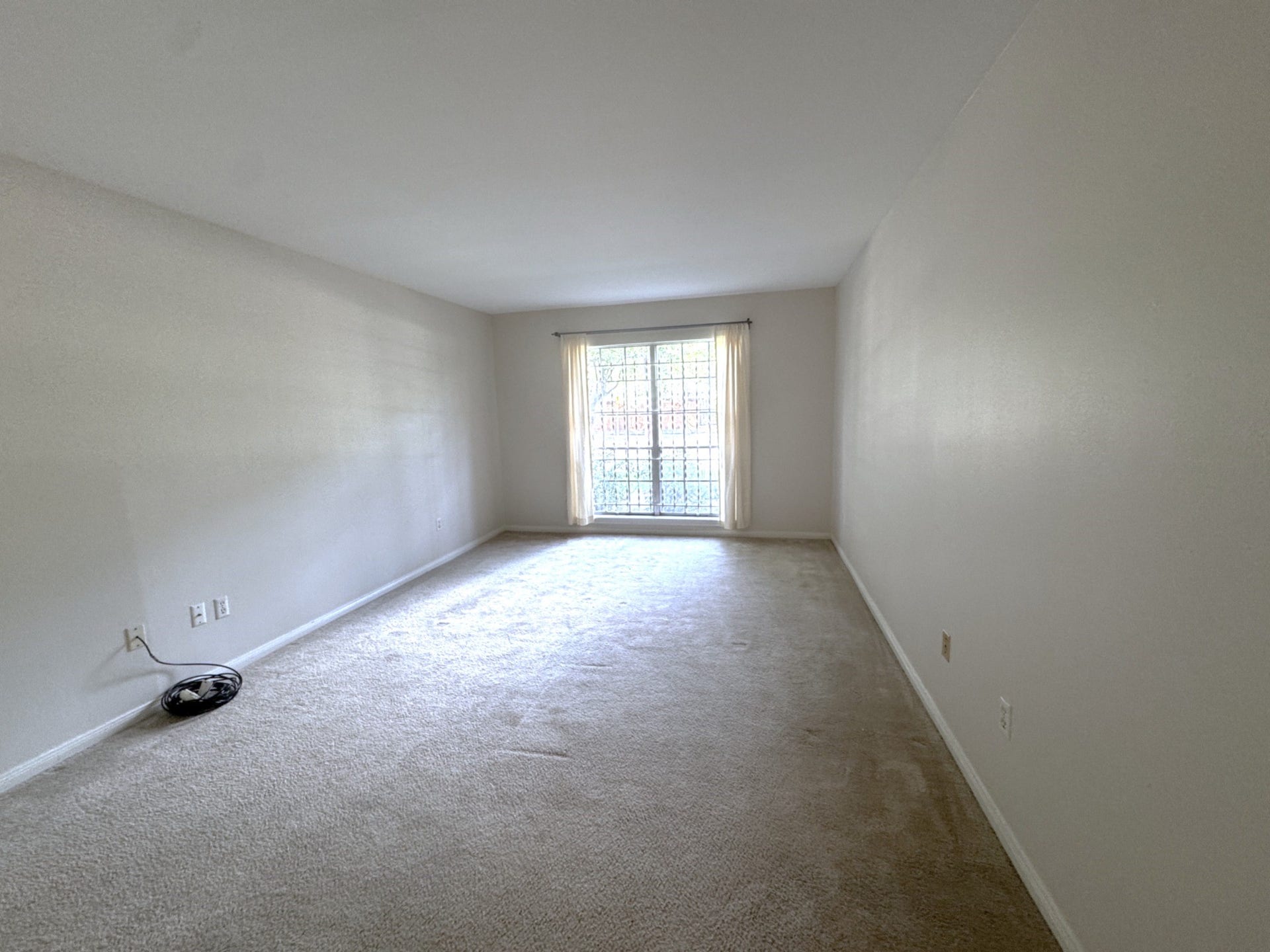 2600 Bellefontaine Street, #A18, Houston, TX 77025 Expansive primary bedroom with soft, neutral tones and ample natural light.