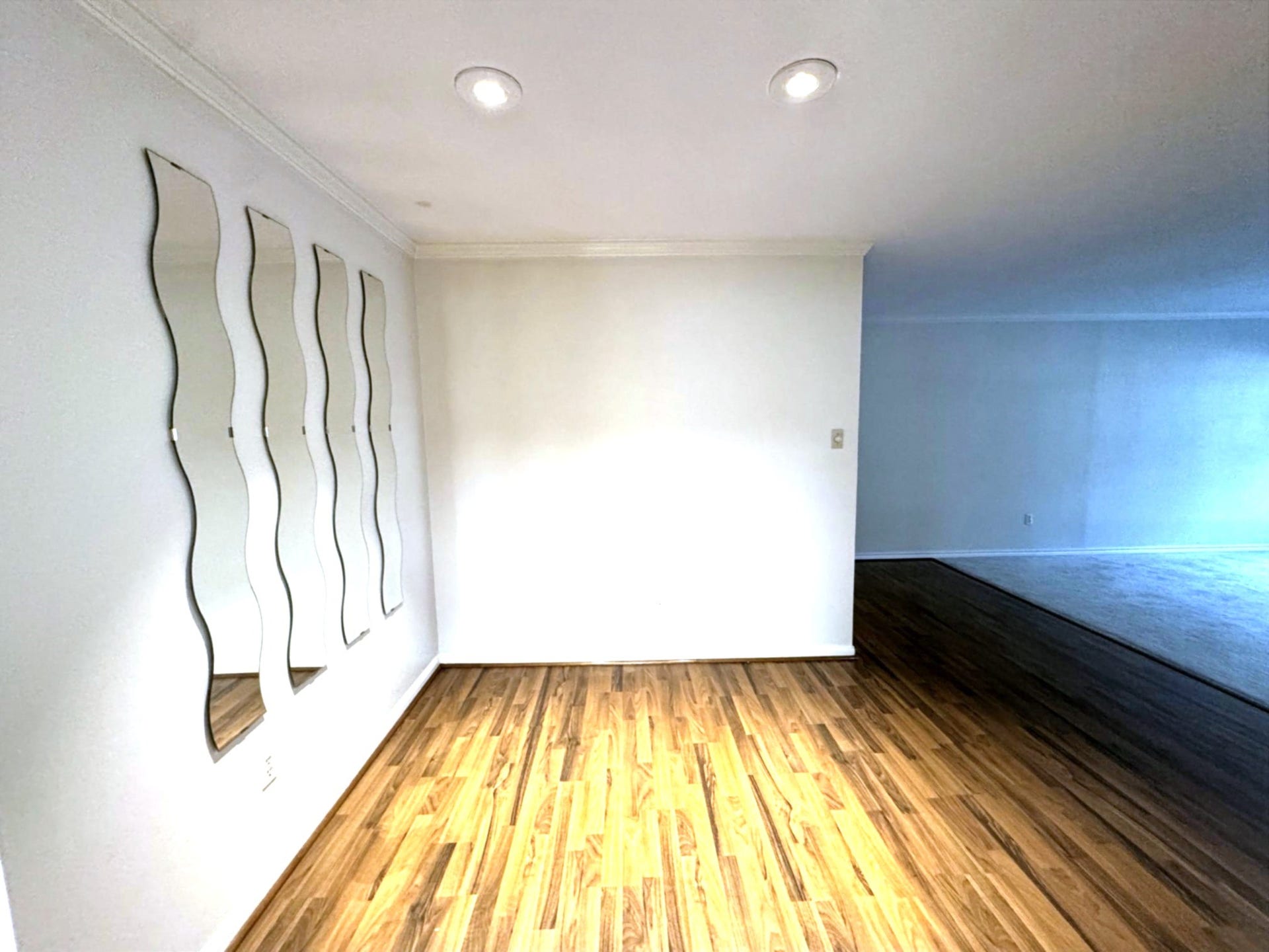 2600 Bellefontaine Street, #A18, Houston, TX 77025 Dining area with stylish canned lighting and sleek wood-look laminate flooring.