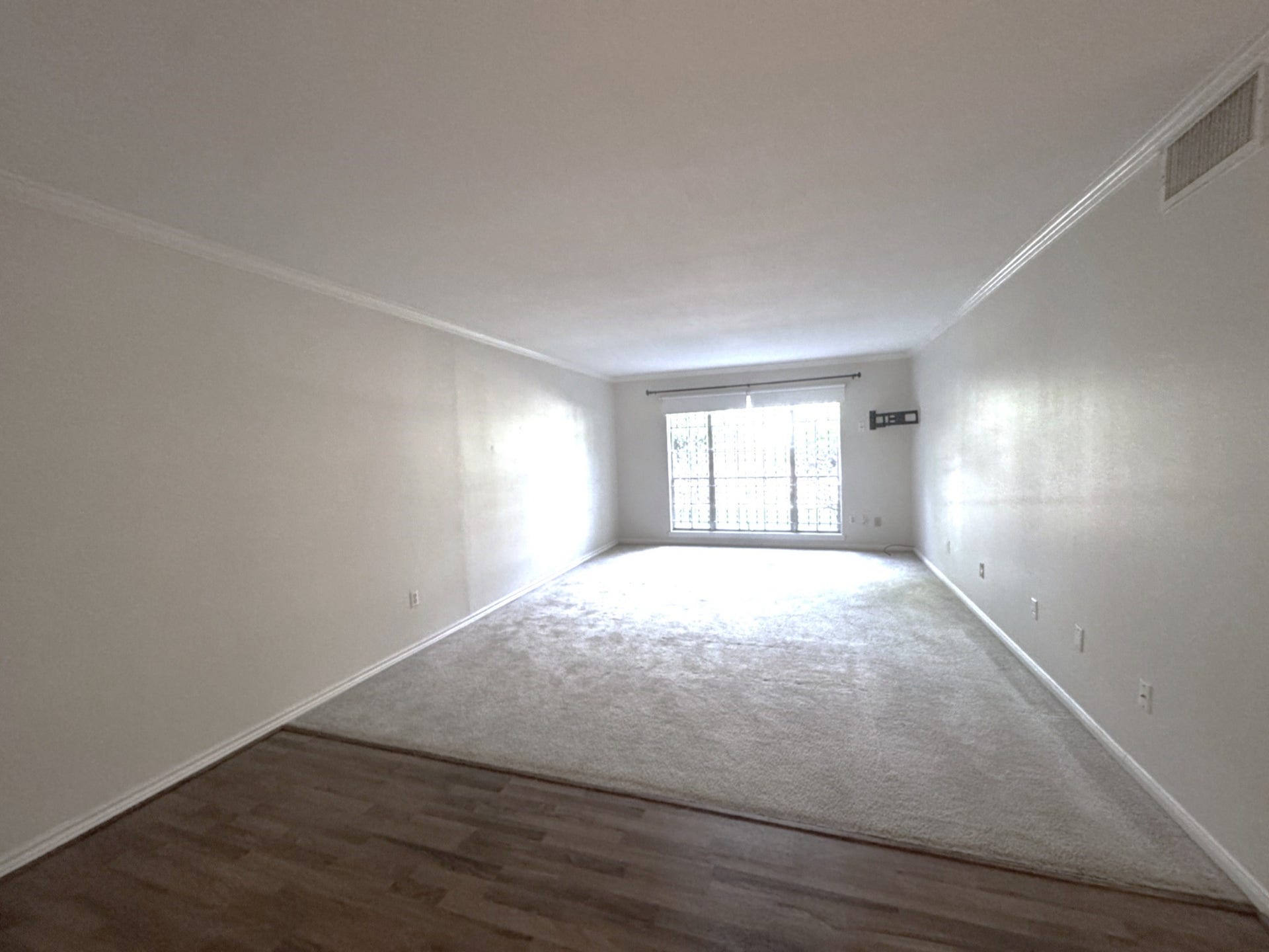 2600 Bellefontaine Street, #A18, Houston, TX 77025 Living area from dining area showing three large windows