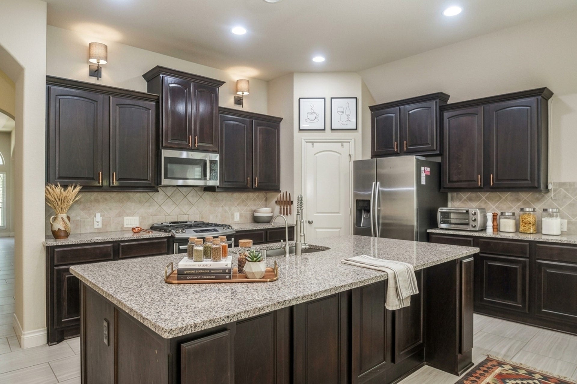 Elegant kitchen featuring dark wood cabinetry, a spacious granite island, and modern stainless steel appliances, perfect for culinary enthusiasts.  AI designed