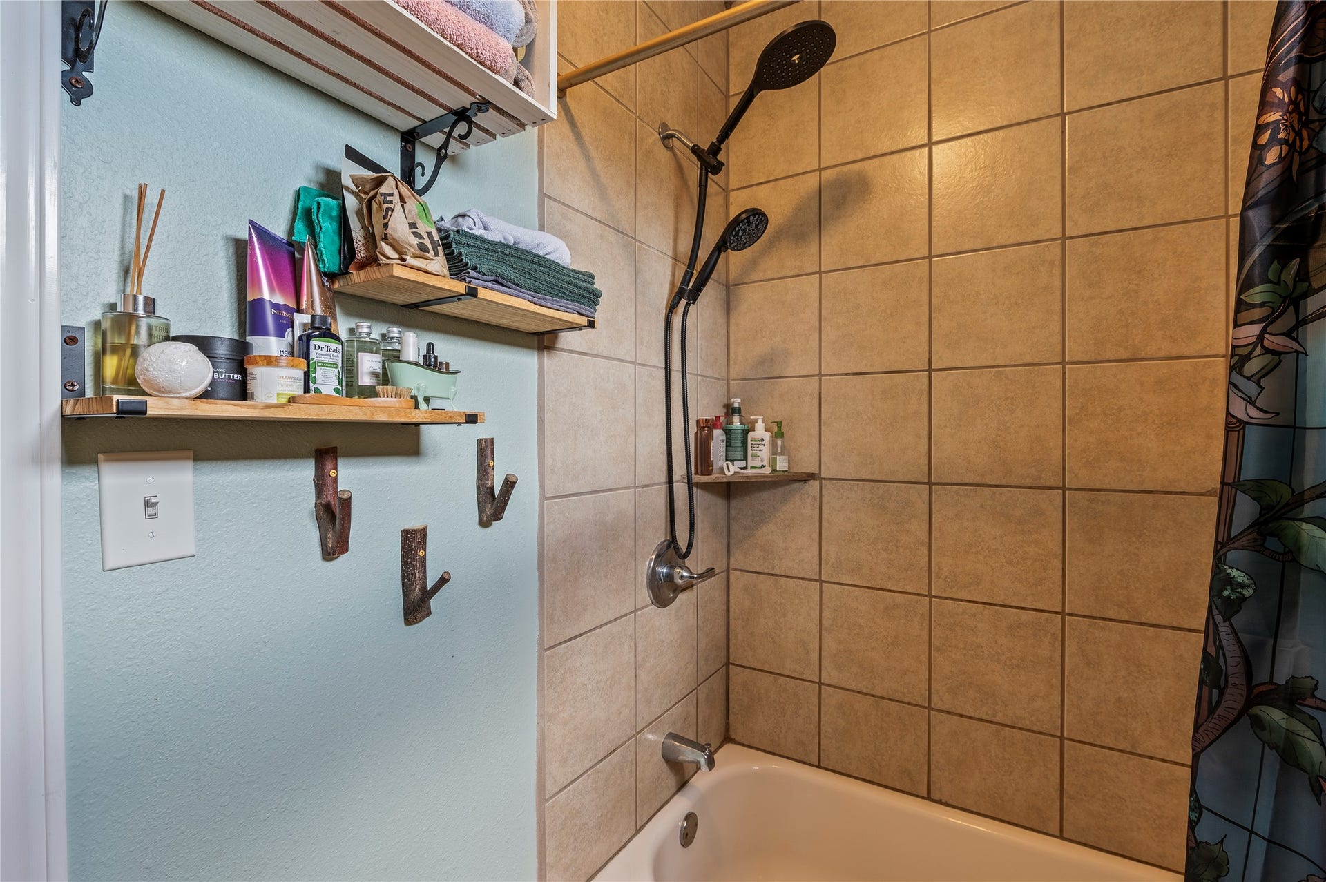 2337 Avenue D, San Leon, TX 77539 Tiled shower/tub combo in the primary bath.
