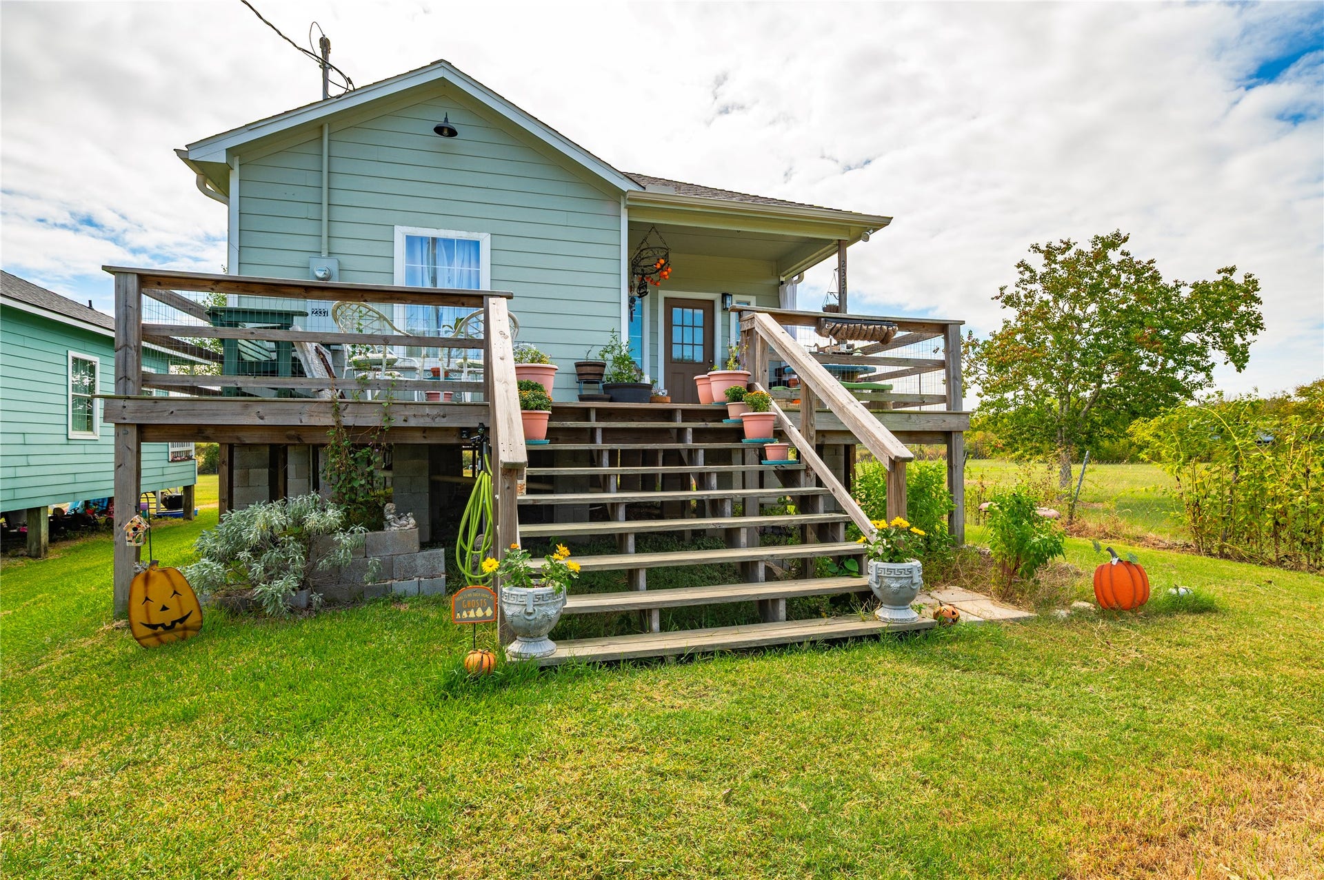2337 Avenue D, San Leon, TX 77539 Large wooden staircase and front deck.