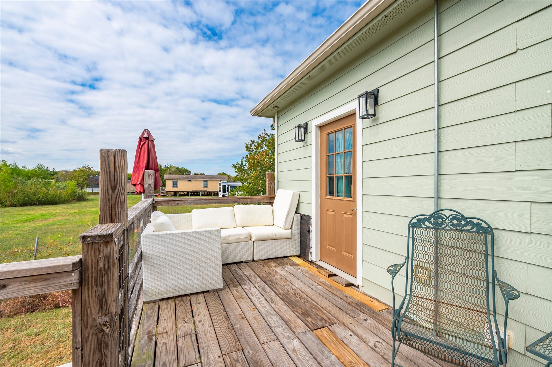 2337 Avenue D, San Leon, TX 77539 Wooden back deck with views into the surrounding fields.