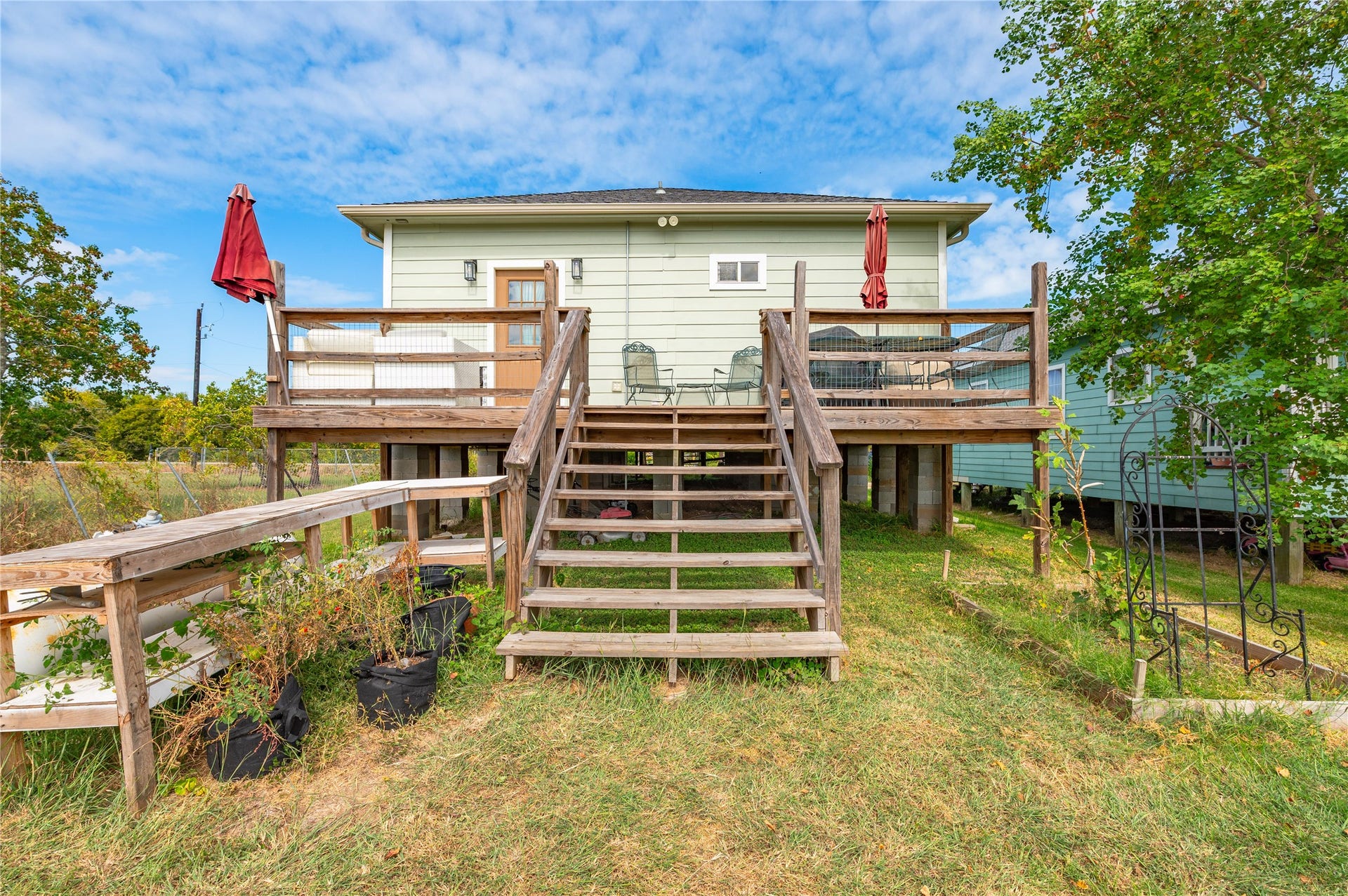 2337 Avenue D, San Leon, TX 77539 Another view of the wooden staircase and back deck.