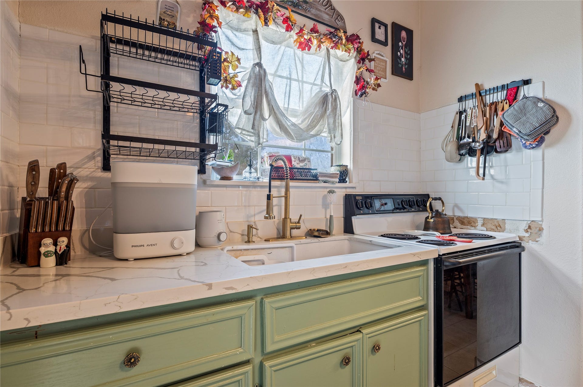 2337 Avenue D, San Leon, TX 77539 Ample counter top space with large sink, over sink window, and electric range.