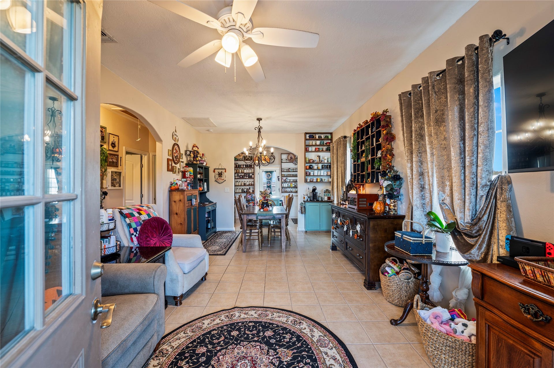 2337 Avenue D, San Leon, TX 77539 Front door opens up to a tiled, open concept living room/dining room design.