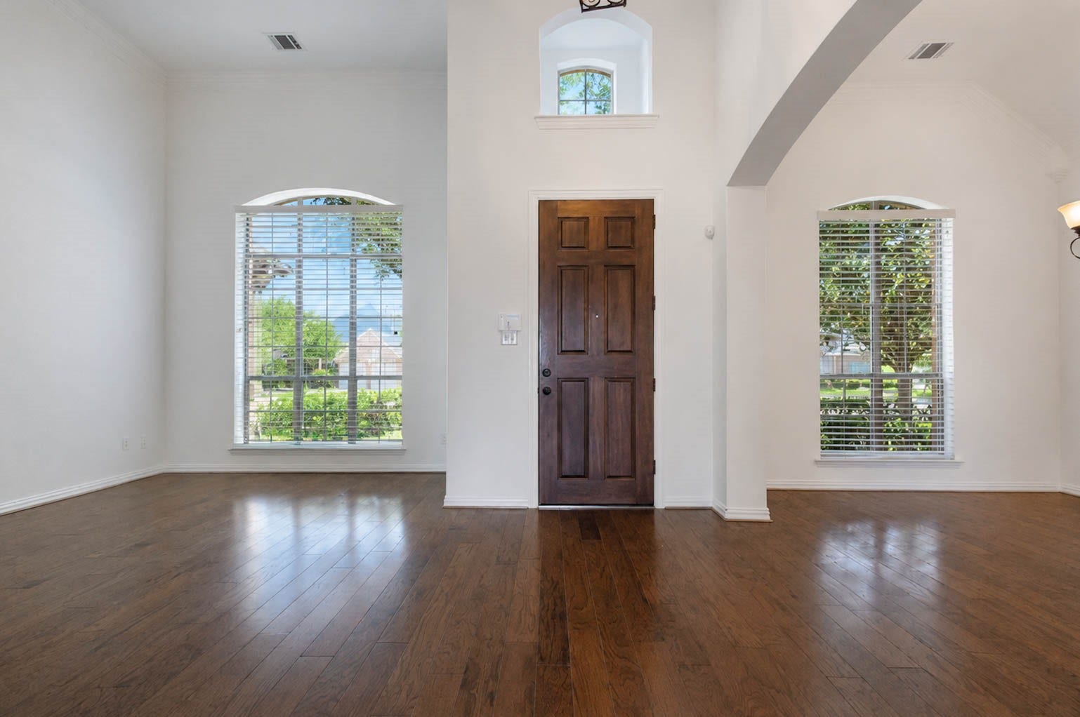 3814 Bluffstone Court, Sugar Land, TX 77479 Step inside to soaring ceilings, rich wood flooring, abundant natural light and an impressive open entry.