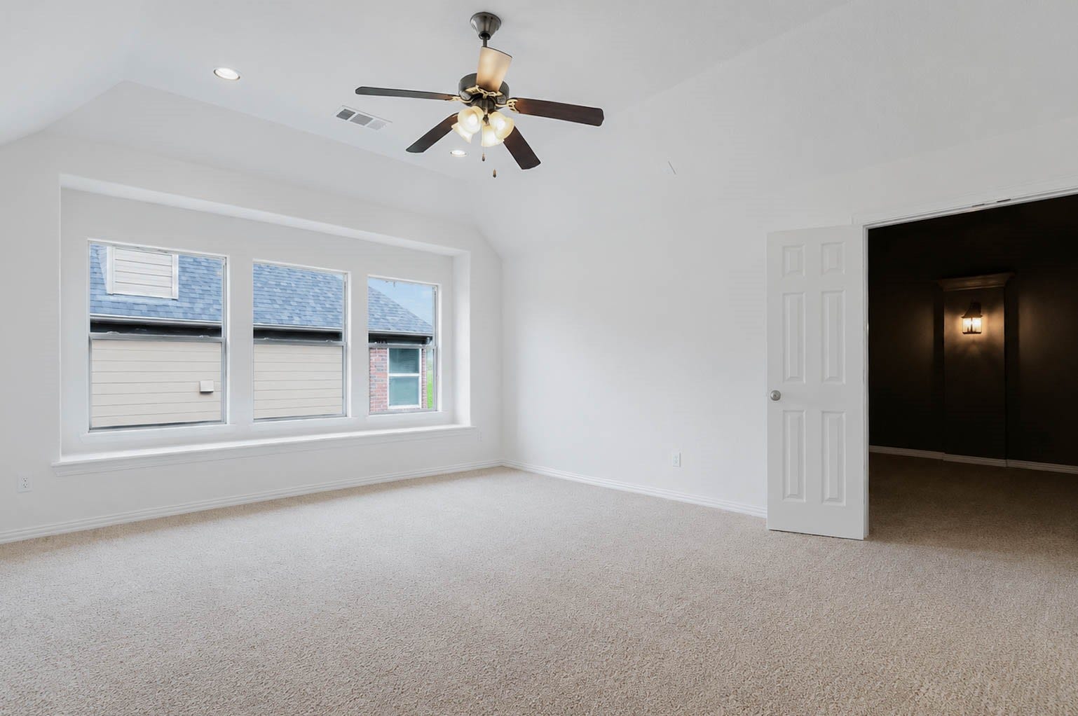 3814 Bluffstone Court, Sugar Land, TX 77479 Spacious primary bedroom with vaulted ceiling, abundant natural light and a large window alcove