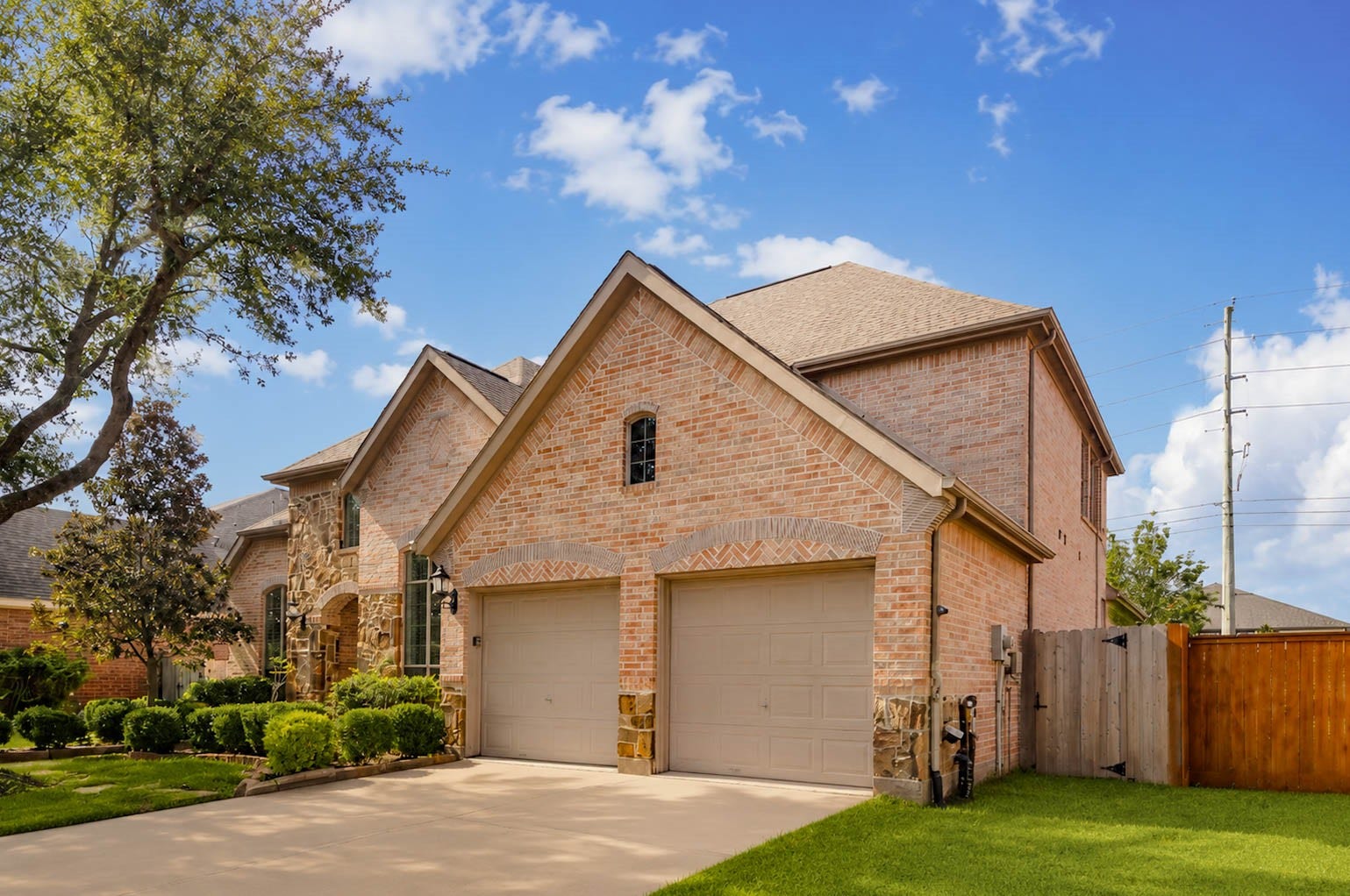 3814 Bluffstone Court, Sugar Land, TX 77479 Garage / Side Elevation
Another view showcasing the home's substantial architecture, brick exterior and convenient garage access.
