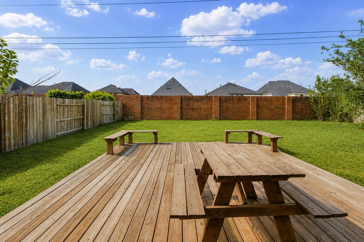 3814 Bluffstone Court, Sugar Land, TX 77479 Expansive backyard with oversized wood deck offering plenty of room for outdoor dining, entertaining and play.