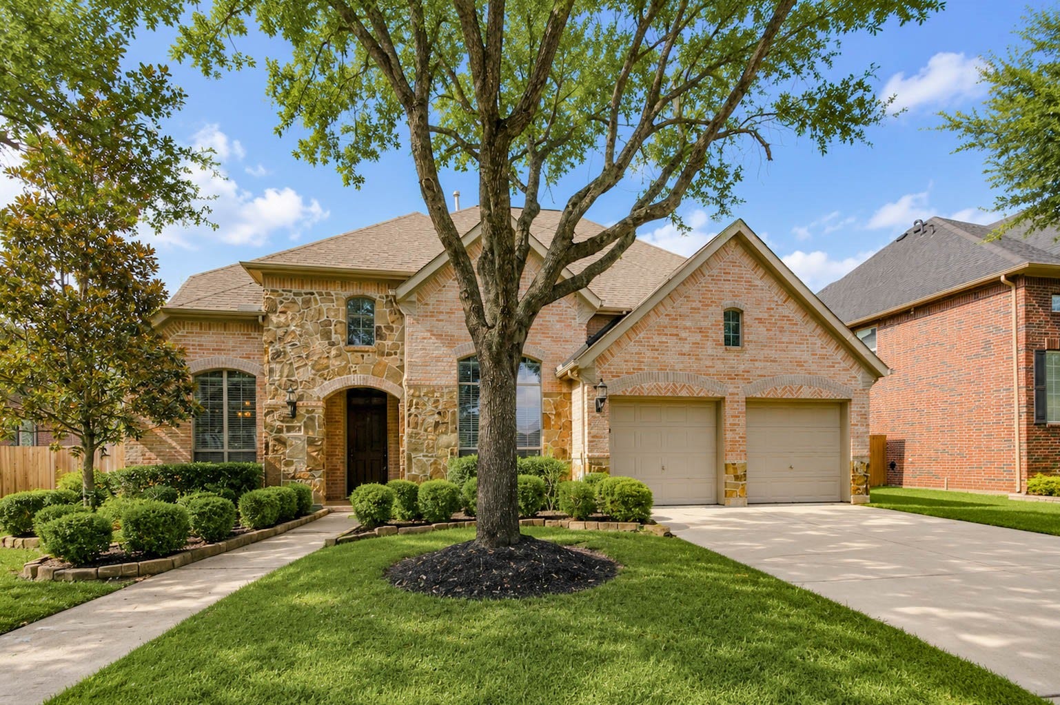 3814 Bluffstone Court, Sugar Land, TX 77479 Front Elevation
Timeless curb appeal with mature landscaping, an inviting covered entry and a classic brick and stone elevation.