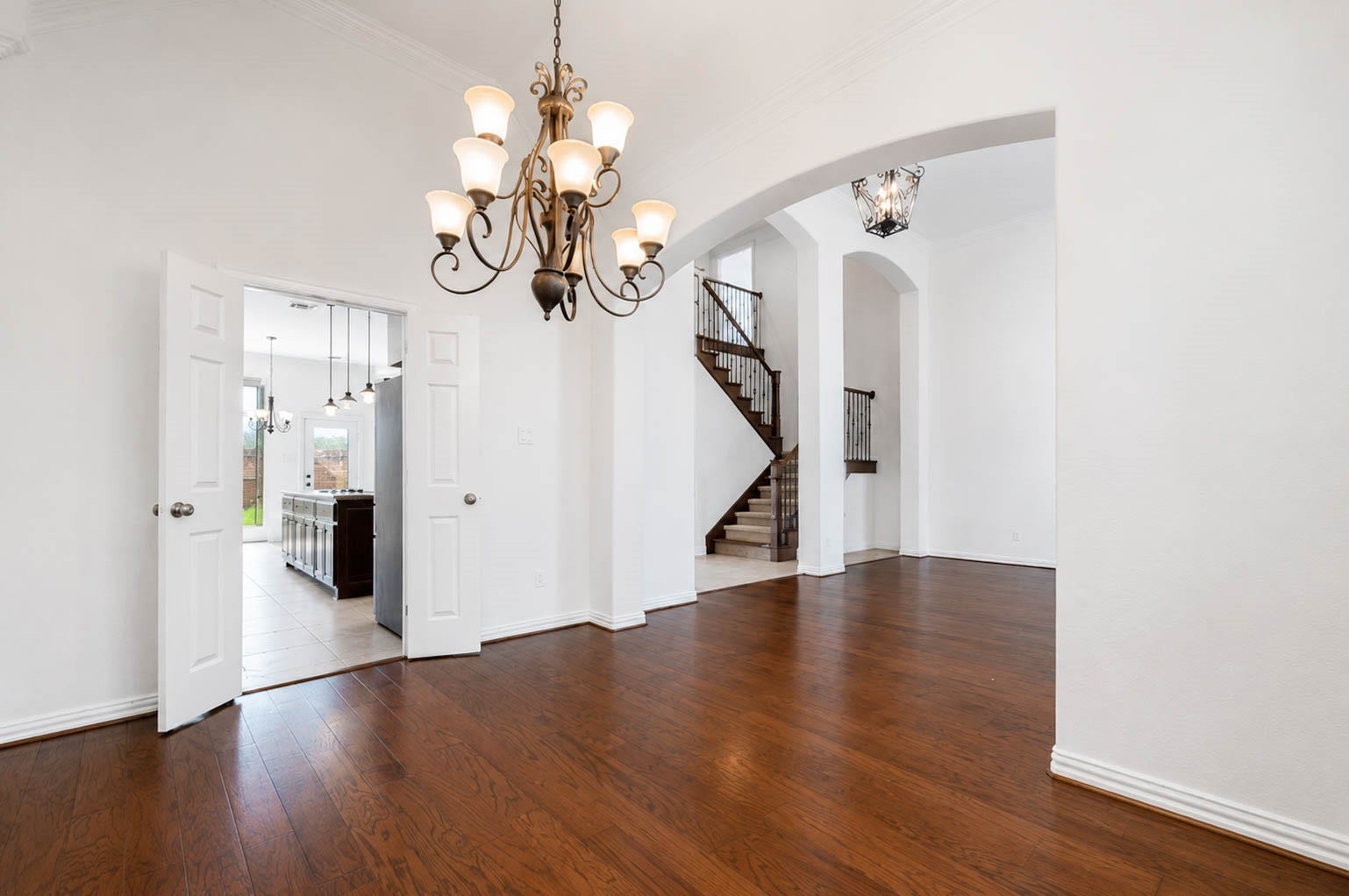 3814 Bluffstone Court, Sugar Land, TX 77479 Spacious formal dining room with high ceilings, elegant chandelier and direct access toward the kitchen.