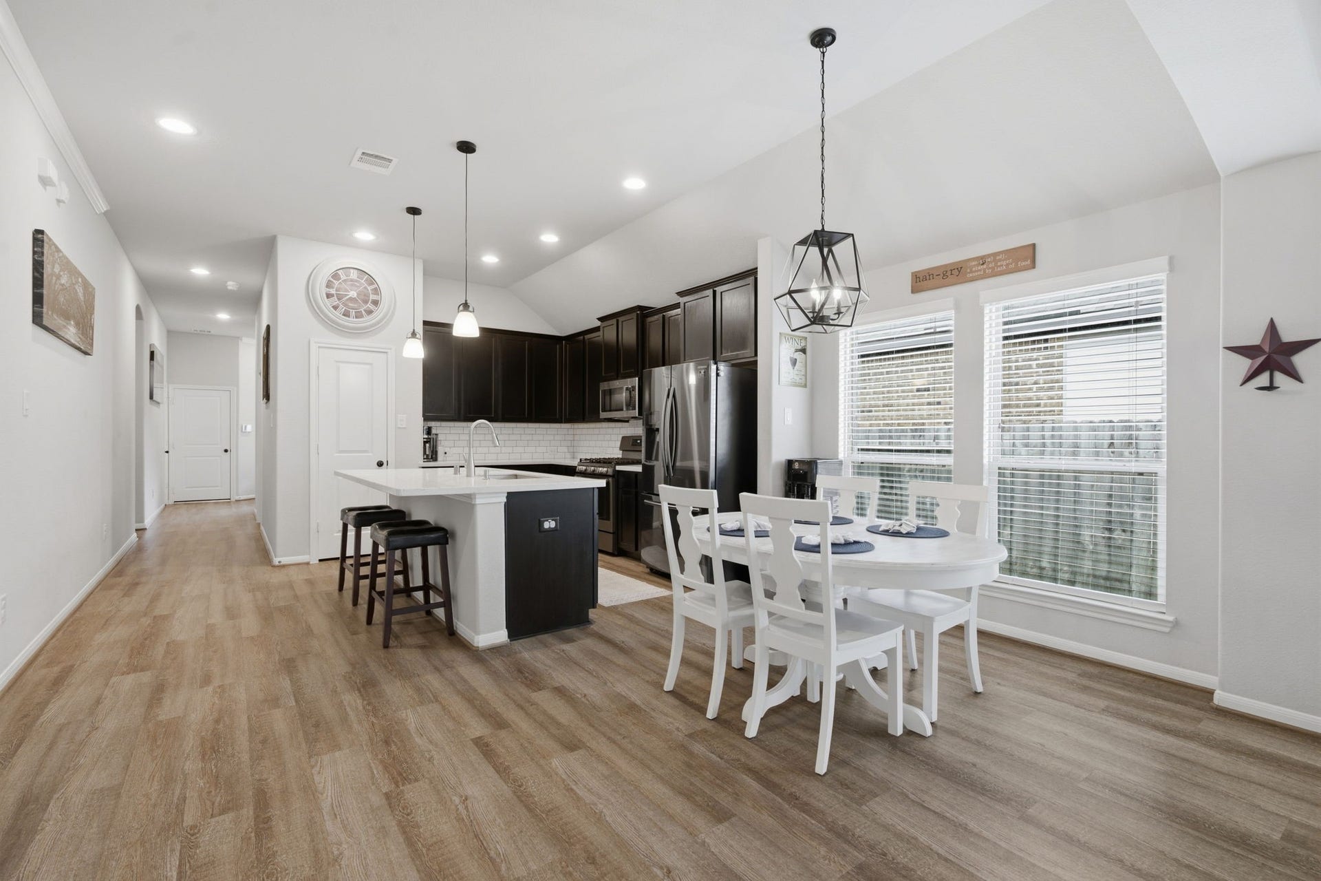 17410 Farm Pasture Trail, Hockley, TX 77447 Notice the natural light, wide plank LVP floors to round out this kitchen & dining area that opens to family room!