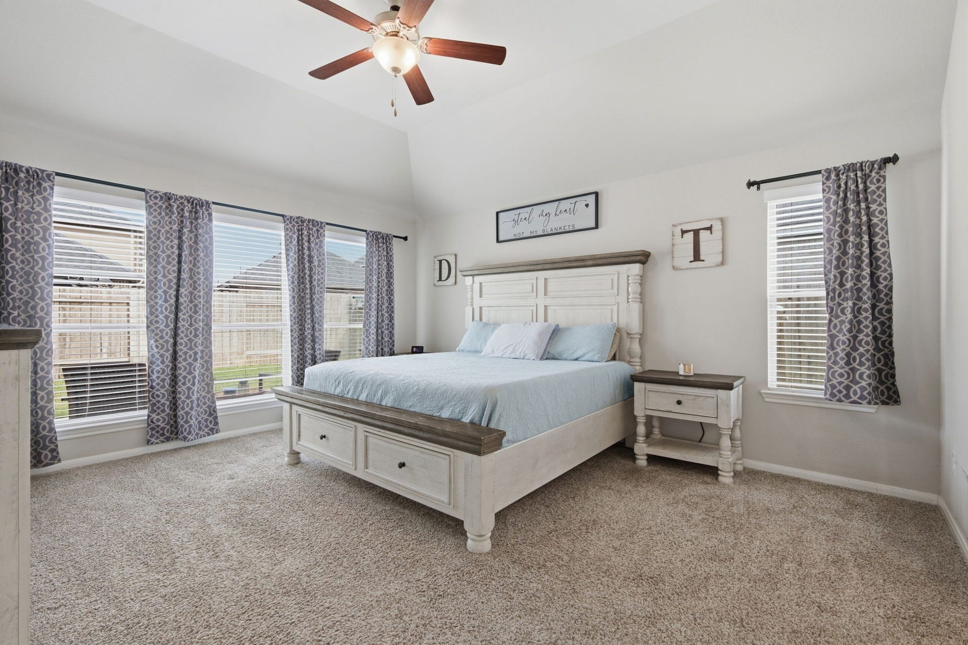 17410 Farm Pasture Trail, Hockley, TX 77447 Primary is spacious enough for all of your furniture! King bed pictured here with nightstands. Ceiling fan and lots of windows too!