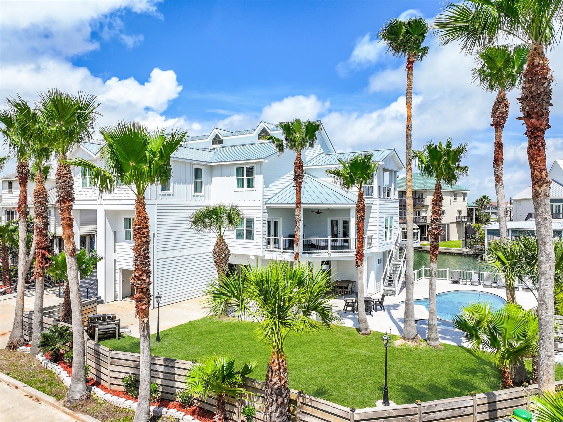 1614 Castaway Street, Tiki Island, TX 77554 This could become the Tiki house everyone simply calls home. With 7,624 sq. ft., two waterfront lots and 132 feet of canal frontage, there is room for generations to gather, spread out and create traditions of their own.